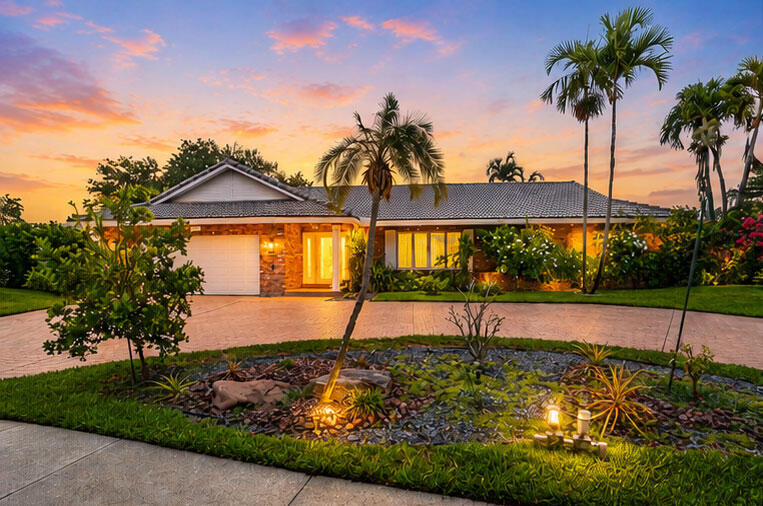 Exceptional updated 3BR/2.5BA lakefront pool home in sought-after The Pines of Deer Creek! This 2,400 SF residence features an open floor plan with 48x24 porcelain tile, 6" baseboards, crown molding, plantation shutters, and abundant natural light. The remodeled kitchen offers quartz countertops, custom shaker cabinetry, subway tile backsplash, farmhouse sink, newer GE appliances, and a large walk-in pantry. Spacious primary suite features two custom walk-in closets and a beautifully renovated bath. Enjoy a large family room overlooking the screened patio, sparkling pool, spa, and tranquil lake views. IMPACT windows and doors, hurricane-rated garage door, 2019 roof, NEW A/C, circular paver driveway, and oversized 14,013 SF fenced corner lot. Low HOA.