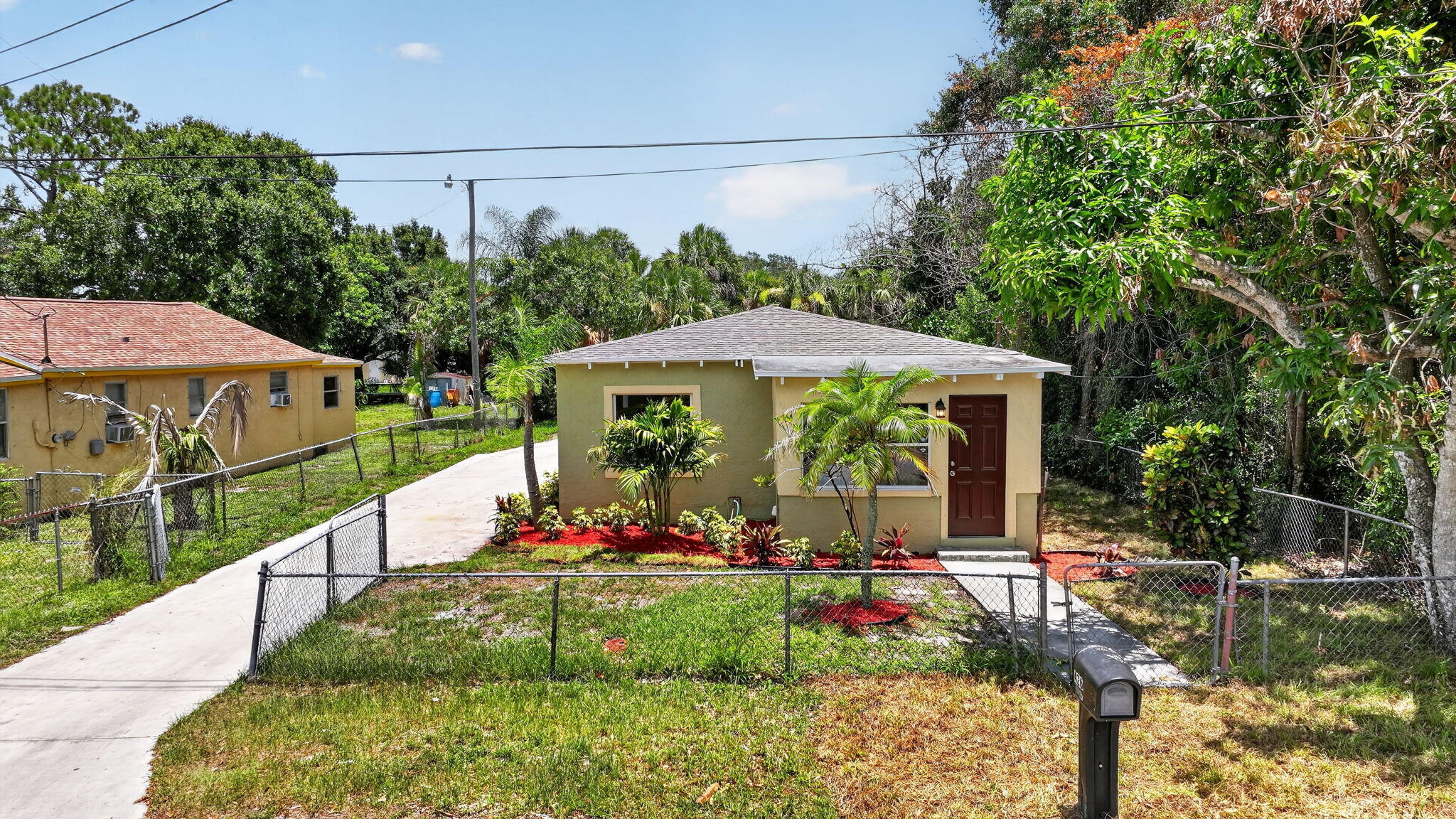 Welcome to this charming 3-bed, 1-bath concrete block home, fully remodeled from top to bottom. It boasts a multitude of recent upgrades, making it a must-see for any discerning buyer. The upgraded kitchen includes soft-closed cabinetry, granite countertops, stainless steel appliances, and recessed lighting. Bathroom comes with stylish finishes. Quality ceramic tiled flooring in wet areas and 10mm thick wood flooring throughout. Updated plumbing and electrical. Painted inside and out. New Roof, new AC, new Water Heater all in 2026. Comes with a large, fenced back yard. Extra-long driveway to park a boat and several cars. A must see.