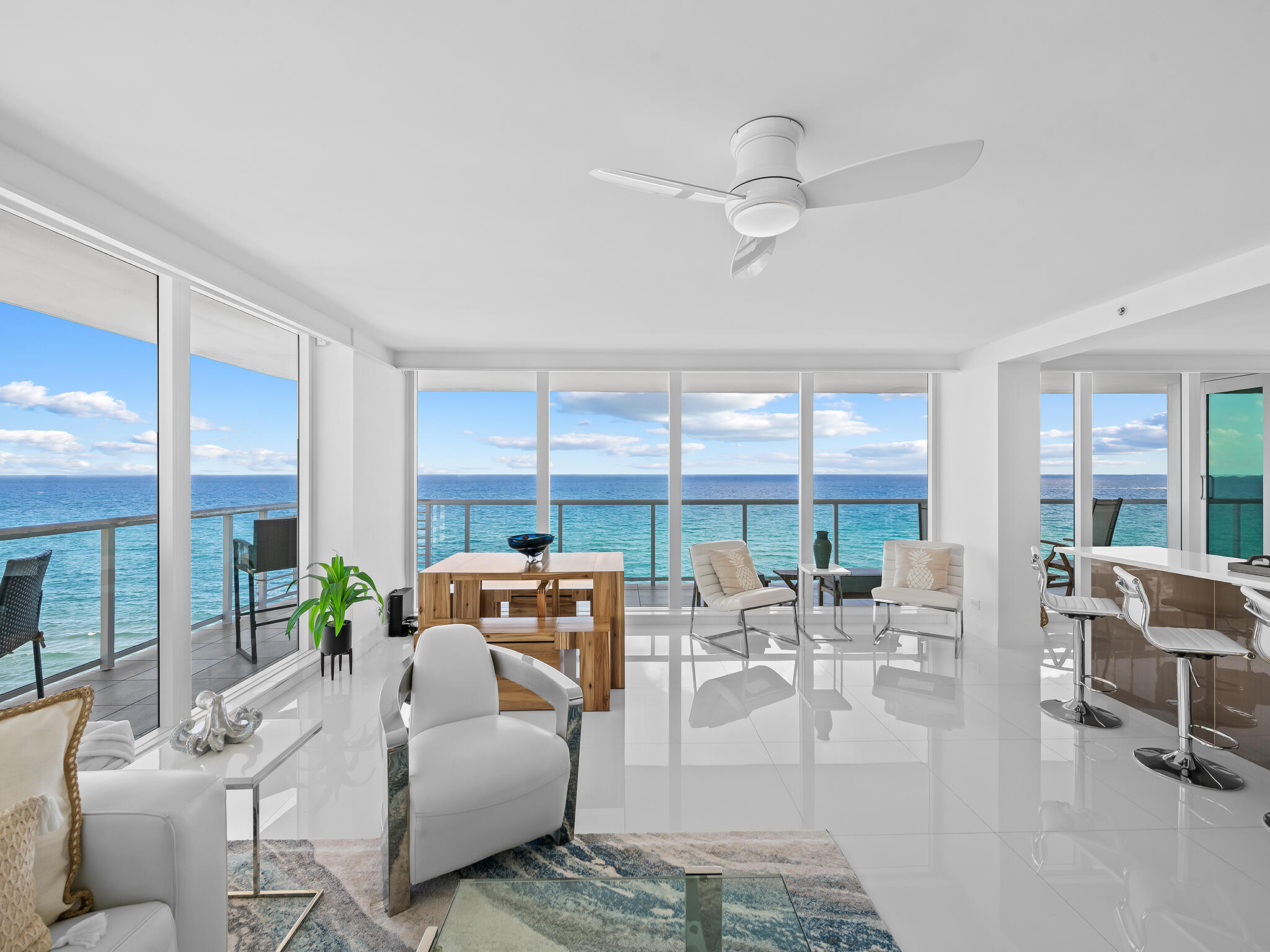 Direct Ocean, outstanding, and renovated 3/3 residence on the sand!  Unit offers long ocean and coastline views, as well as twinkling city lights and intracoastal views, emphasized by the floor to ceiling glass windows/doors and glass balcony railings. The wrap around balcony expands the generous living space.  The property is effectively a double corner unit, as it comprises the entire North side of the building from East to West (ocean to Intracoastal).  The 24 unit ''boutique style'' building offers keyed elevator access to a private foyer entry for each individual residence.  Newly added pool, spa, deck, BBQ lounge, and new lobby and other common areas being upgraded!  A perfect time see this unique property