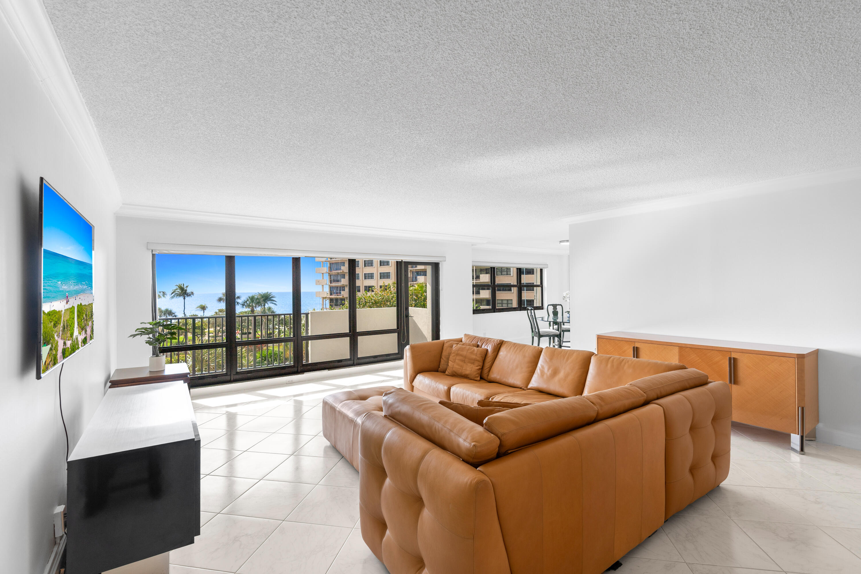 Direct, unobstructed Atlantic Ocean Views from this coveted east-facing 2BR/2BA residence in Sea Ranch Club. Wake up to breathtaking sunrises and enjoy sweeping ocean, pool, and garden views from your living room, dining room, kitchen, and private balcony. Features include impact windows, doors, and shutters, semi-private elevator entry, and a premium parking space directly outside the elevator. Lease immediately with no waiting period. Sea Ranch Club spans 14 beachfront acres with direct beach access, 3 heated pools, 8 oceanside tennis courts, 2 pickleball courts, fitness center, dry saunas, putting green, pet parks, EV charging stations, car wash areas, gated garage parking, and 24-hour attended lobby.