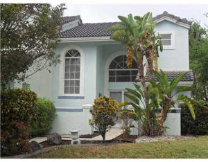 GREAT OPPORTUNITY TO LIVE IN BOCA!!  DIRECT WATERFRONT CORNER HOME! TRUE 4 BEDROOMS AND 2.5 BATHS. LIVING/DINING AREA WITH A SEPARATE FAMILY ROOM OFF KITCHEN AREA. SCREENED PATIO AREA OVERLOOKING LAKE. FENCED IN YARD. NEEDS SOME TLC BUT ANYONE CAN MAKE THIS A GREAT HOME!