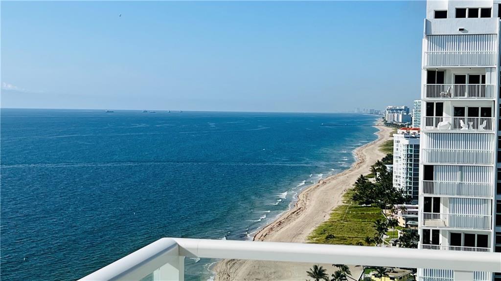 Highly sought after and rarely available Southeast corner unit on a high floor with spectacular direct ocean views all the way to Miami. Beautiful renovations with attention to detail  include 48" tile floors throughout, electric blinds, all new interior doors and trim, lighting fixtures, seamless glass shower doors, Toto commodes, popcorn ceilings removed.   Open kitchen with stainless steel countertops and appliances.  Split bedrooms.  Impact windows and doors.  Washer/dryer in the unit. Designated parking spot in the garage right next to the door.  Amenities include 24 hour security, tennis/pickleball court, pool, sauna, hot tub, fitness center, ballroom and sky lounge.  Seller will pay pool assessment in full.