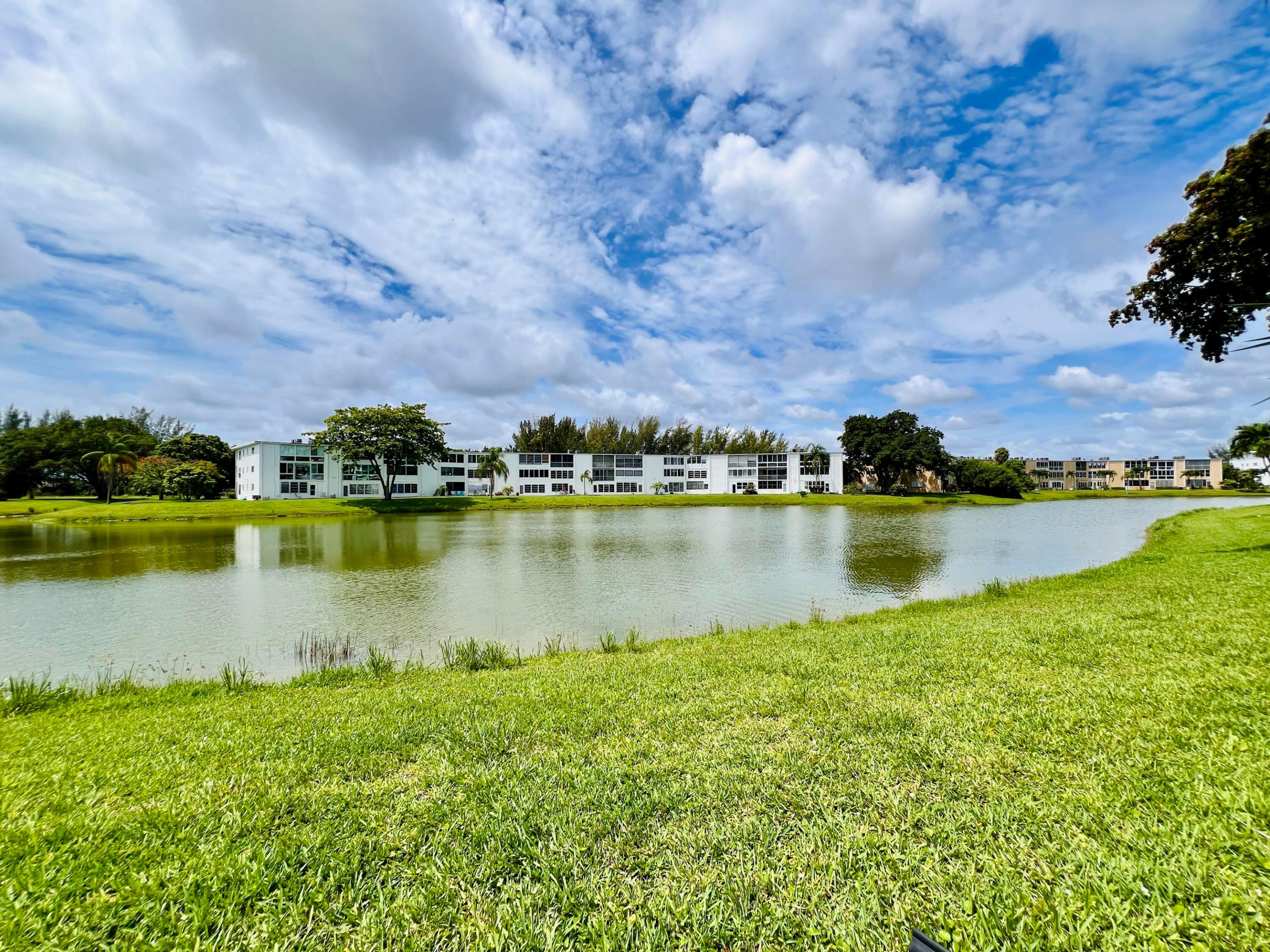 Pretty Views & Great Location In 55+ Century Village! First Floor Over-sized 1/1.5 in the Desirable Wellington Section. Fantastic Enclosed Lanai With Floor to Ceiling Impact Windows Provides Extra Space and the Perfect Spot to Enjoy the Water Views. Spacious Bedroom Suite With Full Ensuite Bath, Access to the Lanai, and Two Closets Including a Large Walk-in Closet. Neutral Tile Flooring Throughout. Luxury Building With Extra Storage, Trash Chutes, and Access to the Two Wellington Section Private Pools. Great Location Close to the Main Clubhouse & Haverhill Entrance. Century Village is a Resort Style 55+ Community Centrally Located in Desirable Palm Beach County, Florida. Enjoy An Active Lifestyle... Century Village is a 55+ Resort Style community with so much to offer - Much To Offer - shows, movies, clubs, pools, security, and transportation service. The Clubhouse features a theater, indoor pool, card room, community/party room, billiard room, shuffleboard, tennis, pickleball, bocce, and two outdoor pools, Numerous heated outdoor pools throughout the community. Separate fitness center with gym and outdoor heated pool & resistance pool. Two guarded gates and 24-hour roving security patrol.