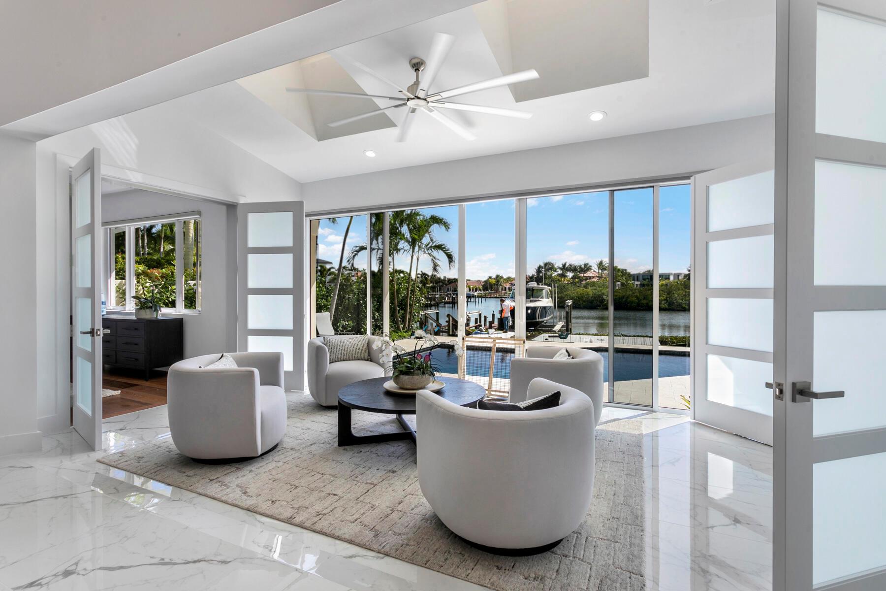 Nestled in the prestigious & coveted club community of Admirals Cove (Jupiter, FL), this fully renovated 3BR, 3BA waterfront villa offers unparalleled luxury & breathtaking expansive water views.   Boasting an open, floor plan, this home seamlessly combines sophisticated style with functional design, creating the perfect environment for both relaxation and entertaining.
Wake up to extraordinary, unobstructed long-water views that stretch as far as the eye can see. This home offers one of the most desirable locations in Admirals Cove, perfect for enjoying sunsets or watching boats glide by.
With its own boat slip and new lift, navigating the waterway provides direct access to the Club's Marina and easy access to & from the Intracoastal & Atlantic Ocean.    (continued) Every inch of this home has been meticulously updated with high-end finishes.  The spacious living area is flooded with natural light that is enhanced by newly installed LED lighting that further illuminates the beautiful interior. The modern kitchen features brand-new appliances, ideal for preparing gourmet meals or casual dining. 
Step outside to your own private paradise, complete with a newly designed pool and spa, perfect for soaking in the sun or unwinding under the stars. The newly enclosed patio adds additional living space, making it an entertainer's dream.
The exterior of the home is equally impressive, with a new driveway and new decking leading to the water's edge.  A new gas firepit sets the stage for cozy evenings by the water, while the entire property is secured with a new security system and cameras for peace of mind.
The home is equipped with a new tankless water heater, new LED lighting, and new security with camera system.
Admirals Cove members and residents enjoy access to world-class amenities including 45 holes of championship golf, indoor golf training facility, tennis, pickleball, full service Marina, state of the art fitness center and spa, year round children's facilities, playground and activities, lap pool, serenity pool, children's pool, jacuzzi, multiple dining venues, dog park, kids and a private marina, boutique hotel for members and their guests, Yacht Club, multiple dining venues, on-site banking, convenience store (with an exceptional wine section carrying inventory at great member prices, and a highly professional staff.  
The Admirals Cove Community's security is high end including manned gates, roaming security, and perimeter security, all supporting a professional security team.

Admirals Cove is located in relatively close proximity to ocean beaches, area restaurants, shopping, the award winning Jupiter Medical Center, Intramodal systems such as I-95, FL Tpk, Palm Beach International Airport and the Brightine passenger train system.

Experience the perfect blend of luxury, comfort, and waterfront living in this one-of-a-kind home.   Living in Admirals Cove is living in paradise.