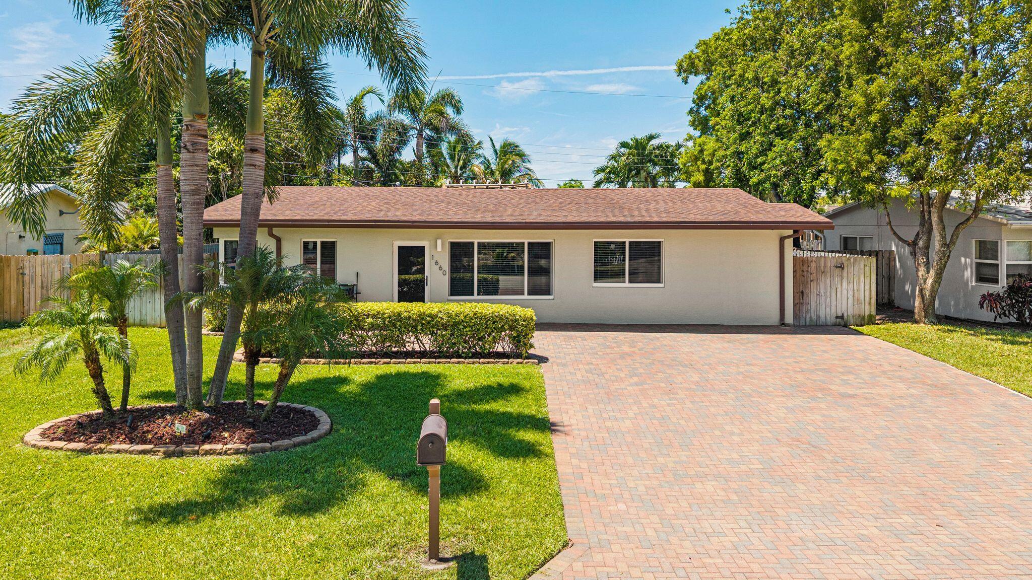 Welcome to this renovated three-bedroom, two-bathroom home located in Pompano Beach. This split bedroom layout offers 1,465 square feet of finished living space, with common space at the center of the residence. The main items have been done, making this a great opportunity to close and move right in. Upgrades include kitchen appliances, tankless hot water heater, impact doors & windows, roof, tiki hut, & astro-turf out back.
