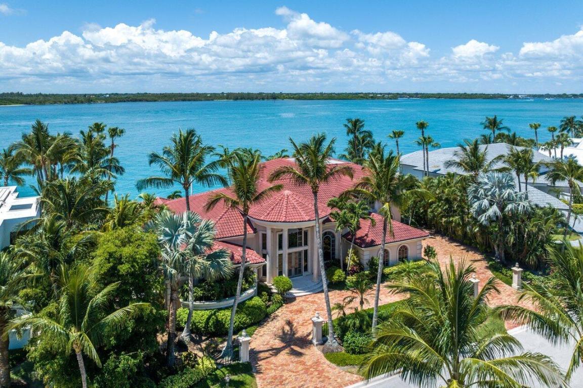 Welcome to this exquisite Mediterranean estate home, perfectly nestled along the breathtaking St. Lucie Inlet. Immerse yourself in the awe-inspiring vistas of the intracoastal waterway and the majestic ocean that this exceptional residence offers. With its grandeur and elegance reminiscent of a mansion, this stunning property features four generously appointed bedrooms and six lavishly designed bathrooms. Whether you're a boater, golfer, or tennis player, the community has it all, including a full-service marina just 59 miles from the Bahamas and minutes from the inlet, able to accommodate up to 125 foot vessel. The Sailfish Point Community is also located within minutes of a Private airport suitable for landing large private aircraft - Witham Field - Stuart Florida with US Customs on-site. Sailfish Point offers the ultimate Florida resort lifestyle with its oceanfront country club, fine & casual dining, Har-Tru tennis courts, Jack Nicklaus "Signature" golf course, state-of-the-art fitness center & spa, helipad, 1.5 miles of gorgeous beach, and 24/7 guarded & patrolled security for peace of mind. Don't miss this once-in-a-lifetime chance to own a piece of luxury oceanfront living!