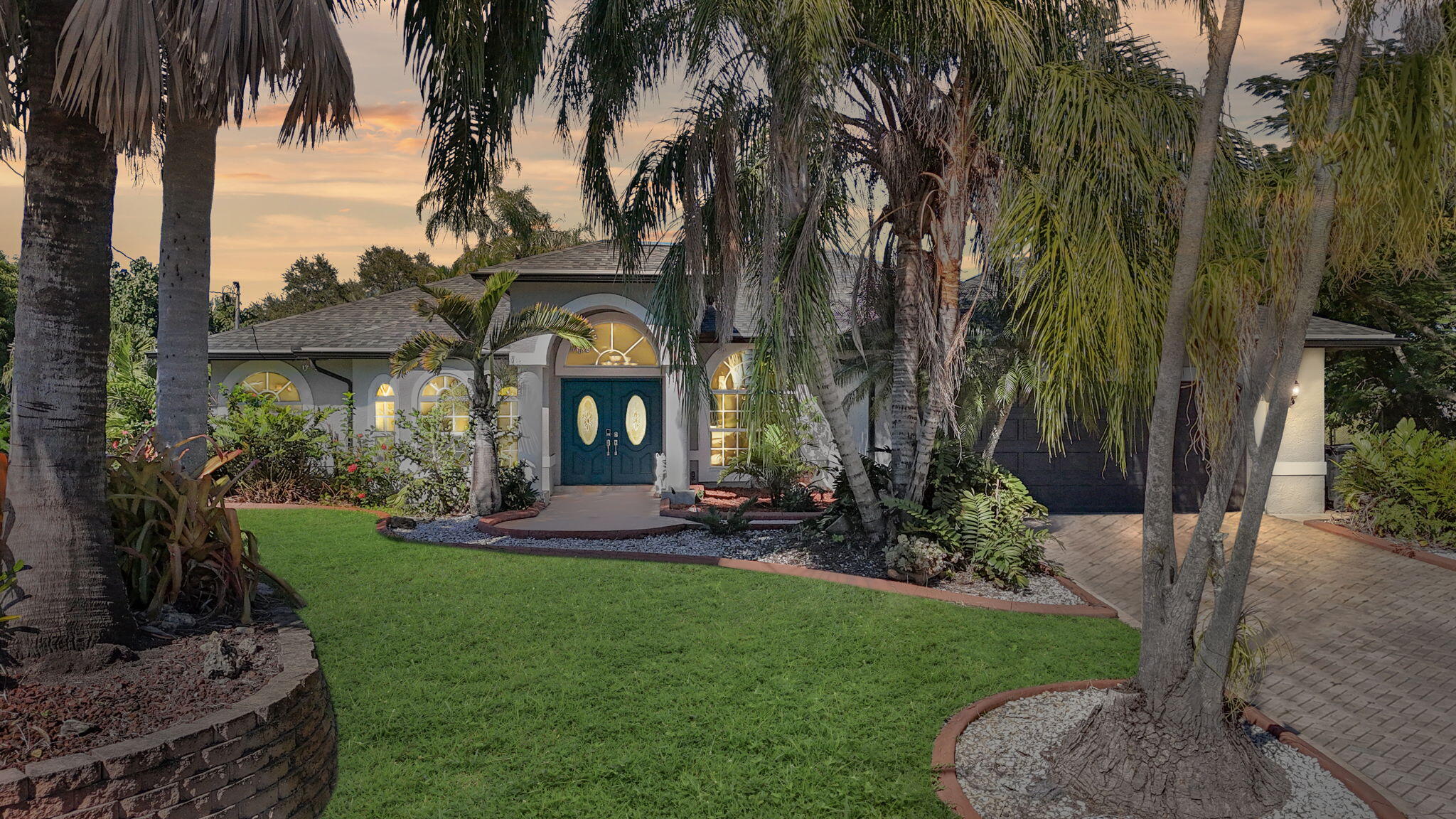 MOTIVATED SELLER ***Discover refined Florida living in this exceptional residence, perfectly positioned on an exclusive cul-de-sac. Set on an expansive, maturely landscaped oversized lot, this property offers a rare blend of privacy, elegance, and natural beauty. A grand double-door entry and stately bay window introduce a bright, sophisticated interior with a flowing split floor plan. Three sliding glass doors create effortless indoor-outdoor living, opening to a lush, fully fenced backyard with fruit trees, an oasis-style pool, and tranquil canal views—with the possibility of installing your own private dock.