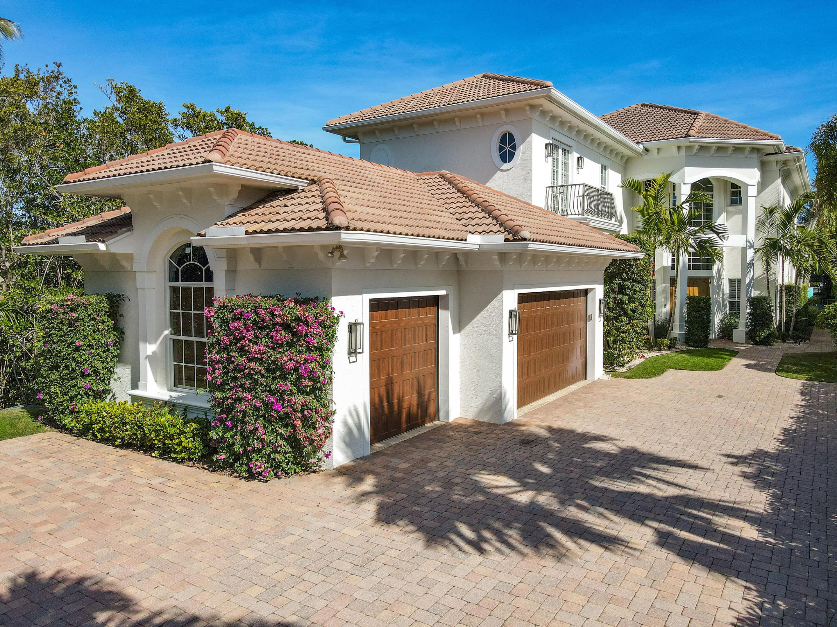 DIRECT INTRACOASTAL–BEST LOCATION IN JUPITER- this one of a kind 6 bedroom home is a recently renovated intracoastal home featuring a unique combination of location, privacy and dockage. Located in a small, gated community in the heart of Jupiter this home offers walkability to restaurants, shopping, theaters, and only a mile from the beach! The backyard's eastern exposure & proximity to the beach enable you to enjoy afternoon coastal breezes in a private backyard oasis with a pool, hot tub, summer kitchen, synthetic turf & a tiki hut where you can enjoy the game while watching an endless parade of boats gently idling by. The ''no wake'' location sits on Jupiter's prime paddleboarding & kayaking waters which also allows you to dock your yacht or 2 smaller boats.