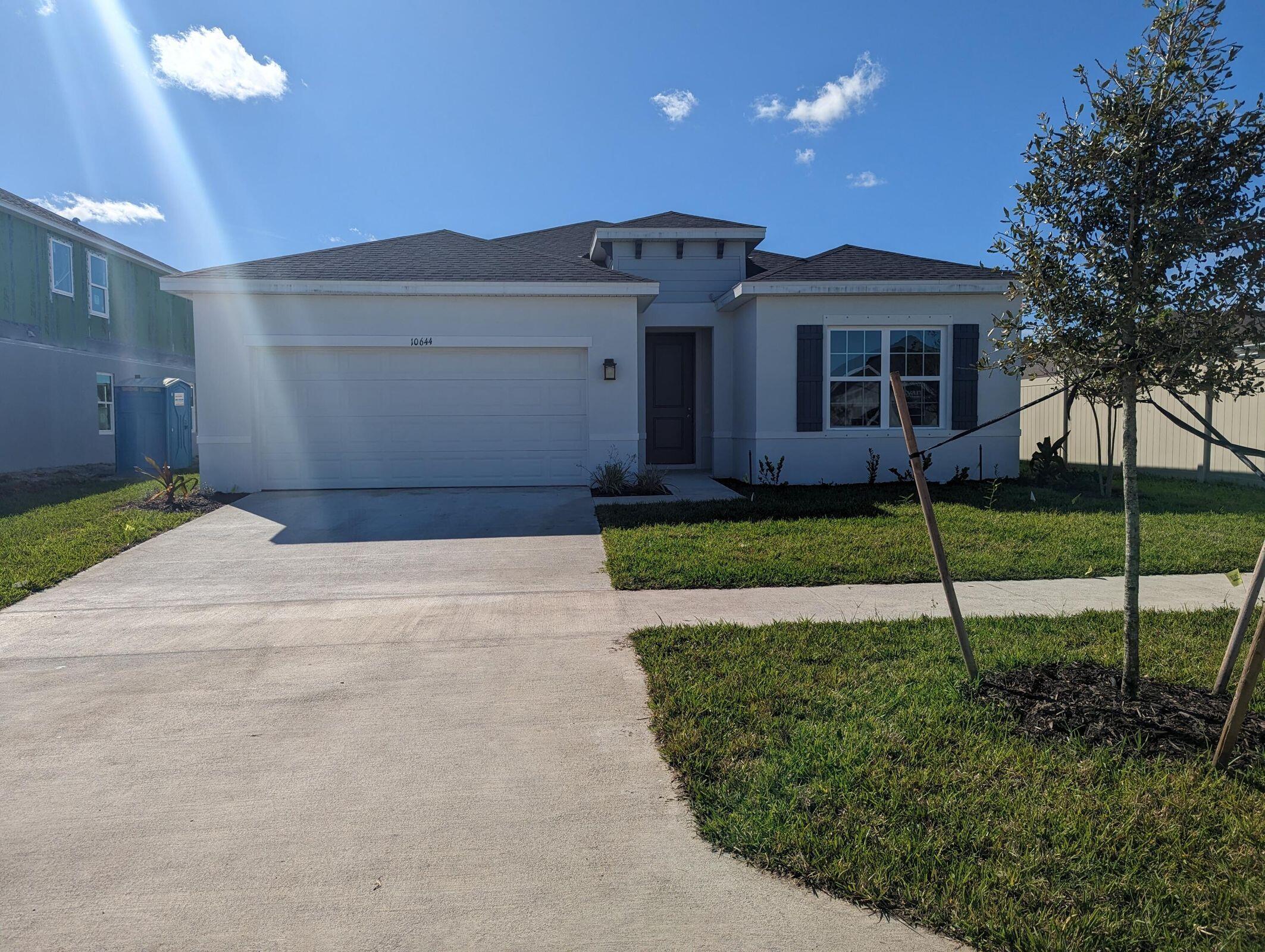 Pets ok with non refundable deposit. No Pit Bulls per HOA. Beautiful Lakefront Home enjoy spectacular sunsets over the lake - Completed December 2022. All tile floors 18K in upgrades 3 bedrooms 2 bathrooms, 2 car garage Granite Counters, pantry, inside laundry, No backyard neighbors. Crosstown Commons is a newer HOA community just at the entrance to Traditions next to Publix Verano grocery store, easy access to I-95 only 30 min to the beach. 45 min to Palm Beach airport, 10 min to Cleveland Clinic Hospital . 10 Min to St Lucie West Shopping or Traditions Shopping and events. Community pool, Playground, Sidewalks, Streetlights.