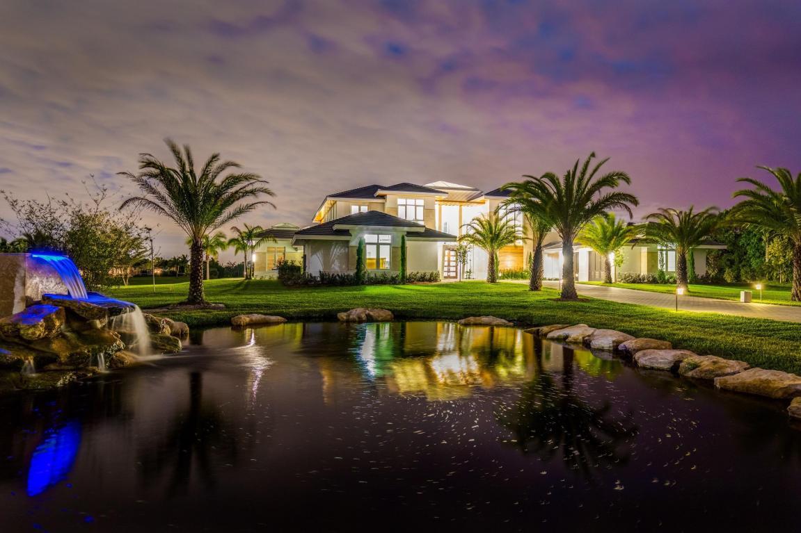 Beautiful Brand New Contemporary Home. Completely Turnkey - Fully Furnished and Decorated by Award Winning Palm Beach Decorator, Decorators Unlimited. Open Concept Floor plan. The nearly 3 acre lot offers the ultimate in privacy. Museum quality Kalwall Sky-roof centered over entrance way showers home with soft diffused light. Stunning Italian Milano Grey Marble throughout the home's first level. Breath-taking Double Island Gourmet Kitchen equipped with state-of-the art Thermidor appliances and endless storage. Share your favorite bottle of wine with your family and friends from the 750 bottle temperature controlled stainless steel and glass wine room adjacent to the impressive over sized formal dining room. After dinner relax in the pool room featuring a custom wet bar, 70 inch TV and custom hand crafted pool table. Control the LED high lights, DXV fixtures, music, pool and all the features of the home from each room on your smart phone as the home is equipped with a full Creston Smart Home System. For the golf enthusiast perfect your putting skills on the putting green wedged between flowing waters and waterfalls leading to an incredible over sized pool overlooking the expansive lake. Make your way up to the Full Concrete 2nd level with custom elevator and follow the beautiful oak floors to the amazing master bathroom featuring a one of a kind exotic rain forest green slab shower. From the sumptuous master bedroom follow the path overlooking the 1st floor and lit by the gentle light filtered by the sky roof to the bedrooms, each room equipped with its own custom bath. Relax outside in the unbelievable 2nd floor spacious outdoor patios overlooking the pool and lake.