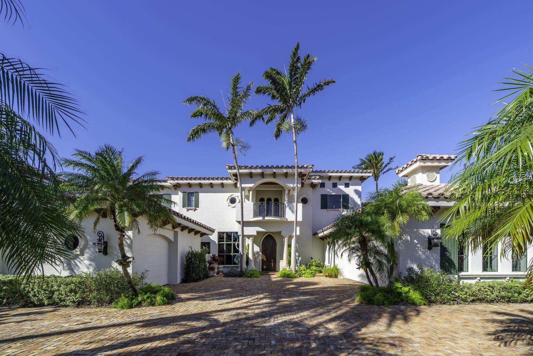 Experience quintessential South Florida waterfront living in this magnificent Intracoastal Estate, with 96+ feet of direct frontage ideally situated in a No Wake Zone, just a short boat ride to Lake Boca, the Boca inlet and the crystal waters of the Atlantic Ocean. Enter the elegant mediterranean inspired estate and you are immediately greeted with stunning views of the bright and open living room with floor to ceiling windows framing the infinity pool and waterway beyond. Designed for lavish indoor/outdoor entertaining, the home's expansive family room features dramatic glass sliders that open to the poolside loggia with Summer Kitchen and resort style infinity pool with spa. Retreat to the spacious master suite with intricately carved fireplace, private office, sitting room, oversized his and hers closets and baths and panoramic views overlooking the water. This impressive 5 BR, 7.2BA home boasts a formal dining room with Venetian plastered walls, a stately den with hardwood floors and built-in shelving, a fitness room and media room. Highlighted interior features include elevator, first and second floor Laundry rooms and second floor loft complete with wet bar. Set in the charming beachside enclave of Riviera, steps away from the pristine beaches and the boutiques and eateries of Mizner Park and Palmetto Park Road, residents can enjoy all the charms of a pedestrian lifestyle.