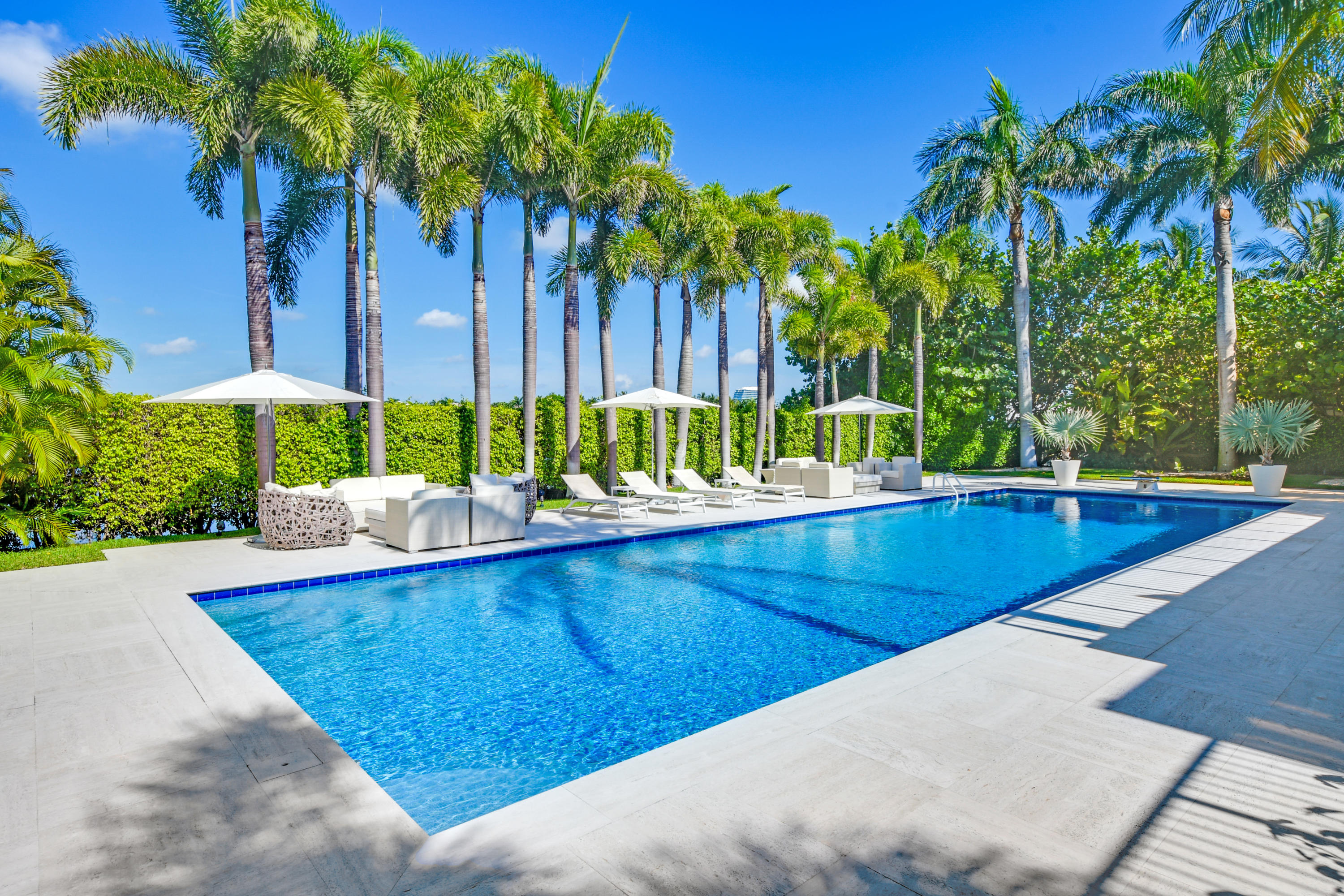 Beautiful John Volk lakefront residence located in the prestigious Estate Section on El Brillo Way.  Westerly views of Tarpon Island & Everglades Island.  Staff house, pool house, 3 car garage.  Southern exposure.