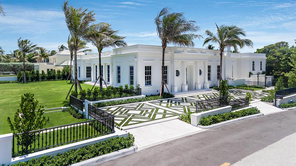 Rarely does an oceanfront home of this caliber come along.  This newly renovated home was built from the ground up to the highest quality. This crisp, classic Regency-style 4 BR/6.1 BA home with pool and pool house is pure perfection. Designed for today's buyer, this important 6,274 square foot home has high ceilings, bright open floor plan, and high-end, tasteful finishes.   Relish the captivating ocean views from both the living room and 2 bedrooms. The master BR features 2 large, stunning his/her bathrooms and closets.  Pale wood European oak floors and large doors opening to fabulous outdoor areas are ideal for casual elegance and entertaining.  State-of-the-art white chefs kitchen with top-of-the-line appliances, electronics, etc.  Hurricane impact windows and retractable sliding door throughout with invisible screens, shades and much more. Two car garage. Located on "Billionaires Row" and only minutes to midtown. 130' of vacant oceanfront with private beach access. High elevation of 20'. NOT TO BE MISSED.