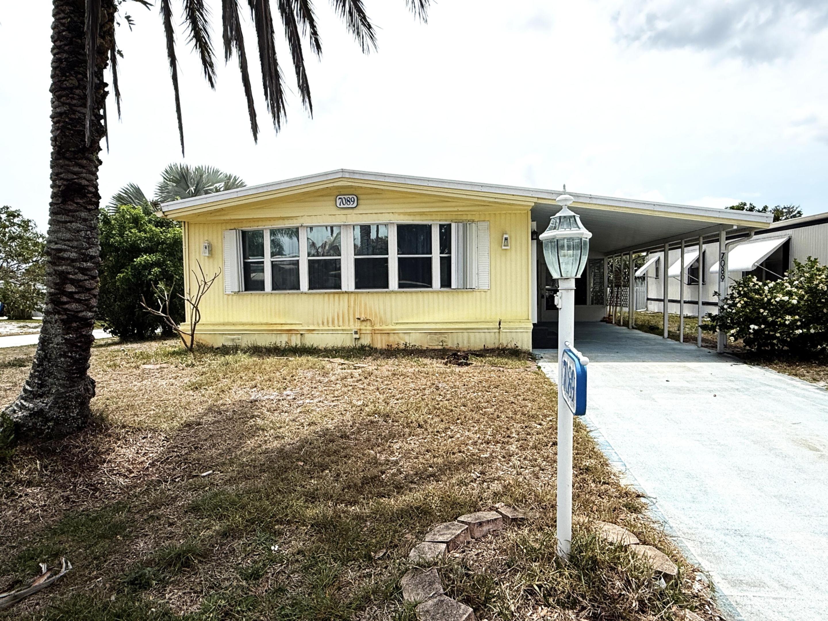 SHORT SALE! Beautiful Corner Doublewide in Ridgeway, all ages, community in Hobe Sound. 2 Bedrm/2 Bath plus tropical side lanai. 1429 sf under new 4 Ton A/C 2023 & an additional 404 sf w Split A/C unit for Lanai. Major updating was done on this home in 2017 w new luxury vinyl flooring thruout, new vanities, toilets, granite counters, step in shower & jetted tub in both bathrooms. The LR is large & light filled leading out to the front facing FL Room. So much living space! The spectacular side lanai makes you feel like you're in the Keys! Both bedrms are large w double closets & walk in closets. This model has incredible storage space. The kitchen also has additional storage, reverse osmosis under sink. YOU OWN THE LAND, ALL PETS WELCOME, NO HOA, BRING YOUR BOAT/RV. Mins to ocean beaches.