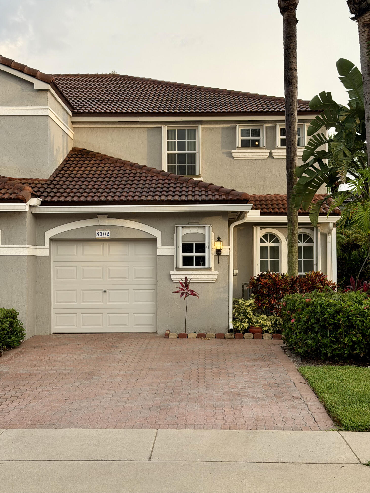 Welcome home to luxury and peace of mind in a highly sought-after gated community zoned for the area's best schools! This immaculate 4-bedroom, 2.5-bathroom townhome features an attached 1-car garage, brand-new hardwood flooring, and a kitchen equipped with premium granite countertops and stainless steel appliances. Upstairs, all four bedrooms are quietly situated away from the living space, including a private primary suite. Enjoy resort-style living with exclusive access to the community clubhouse, fitness center, sparkling pool, and tennis courts. Built for ultimate durability and major insurance savings, the property boasts a newer roof, complete impact-resistant windows, and easy-to-use accordion hurricane shutters. Do not miss this rare opportunity—schedule your private tour today!
