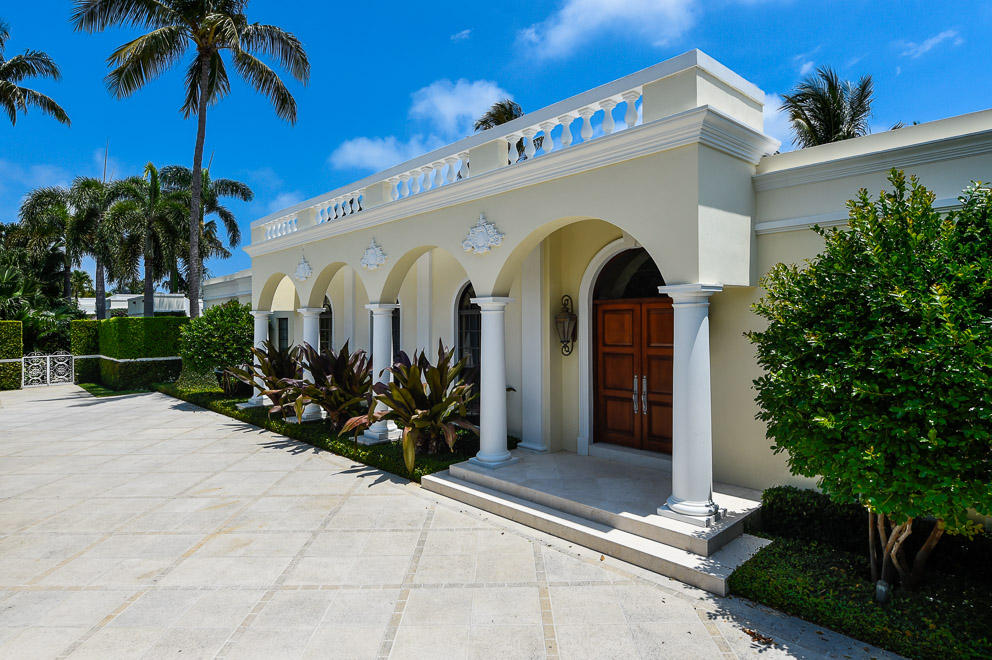 Mini compound (over 1/2 acre) on prestigious North Lake Way. This elegant Gottfried Regency was restored with gracious scale, style, and state of the art finishes. It's 4 BR main house with floor to ceiling windows, 2 BR guest house with full kitchen & cabana/entertaining bar area are surrounded by Morgan Wheelock gardens.