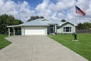 This nicely remodeled home sits on a spacious ½-acre lot in the highly desirable Lazy 7 Estates, just 3 miles from town. The home features a new metal roof installed in 2024, AC replaced in 2022, and a new water heater.  Inside, you'll find an open-concept floor plan with granite countertops, all new stainless steel appliances, and an abundance of cabinets and storage throughout the home.  The large master suite offers a relaxing retreat with a beautiful master bathroom.  Enjoy outdoor living in the fenced backyard, complete with brick pavers, seating area, and a fire pit, the back porch is perfect for relaxing or entertaining.  Includes a 1 1/2-car garage and concrete driveway with extra attached carport. Home also comes with an EV outlet for your car.