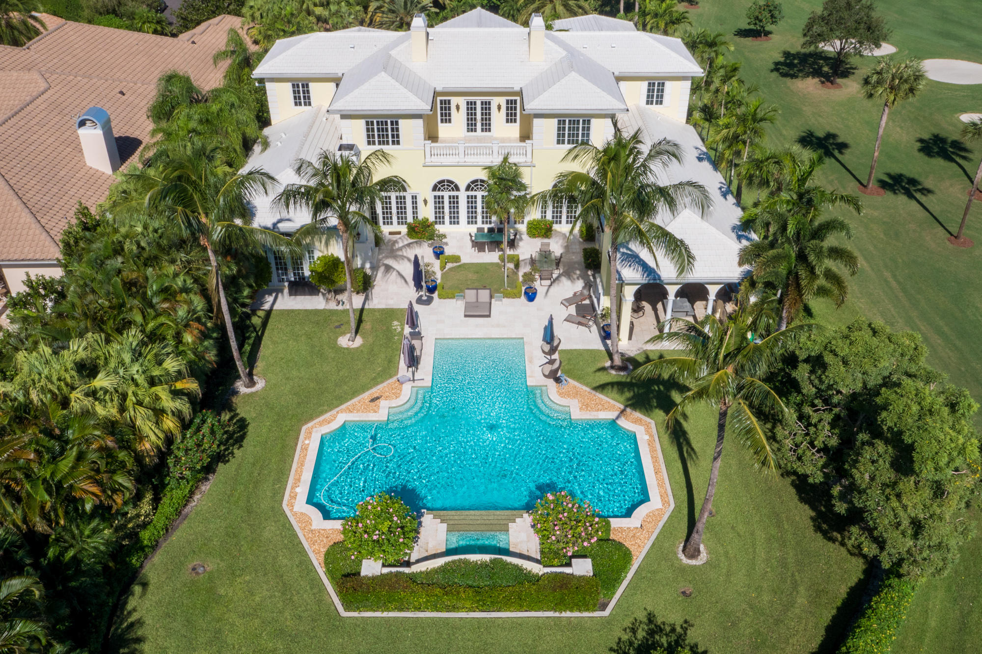 Spectacular Custom Estate situated on nearly an acre home site with panoramic golf and lake views!  This exquisite home was newly constructed in 2009 with the finest workmanship and the highest level of quality and finishes. The 10,000 sf + residence features extraordinary architectural detail throughout including soaring 14ft ceilings, exposed rich beams, elegant marble flooring, French-styled impact glass doors and windows that look out to the pool, spa and scenic golf views.  The home has a very functional floor plan with a sprawling downstairs master suite with enormous his and hers walk-in closets, grand and luxurious his and hers bathroom, onyx morning bar in the mater foyer and spacious sitting room. The spacious office/library with detailed ceilings and built-ins is also downstairs Spectacular Custom Estate situated on nearly an acre home site with panoramic golf and lake views!  This exquisite home was newly constructed in 2008 with the finest workmanship and the highest level of quality and finishes. The 10,000 sf + residence features extraordinary architectural detail throughout including soaring 14ft ceilings, exposed rich beams, elegant marble flooring, French-styled impact grass doors and windows that look out to the pool, spa and scenic golf views.  The home has a very functional floorplan with a sprawling downstairs master suite with enormous his and hers walk-in closets, grand and luxurious his and hers bathroom, onyx morning bar in the mater foyer and spacious sitting room. The spacious office/library with detailed ceilings and built-ins is also downstairs along with the custom soundproof theater, 2 bedroom suites and the beautiful gourmet kitchen as the center piece adjacent to the family, living and dining rooms.  The oversized island kitchen has Hand crafted, custom made cabinetry, oversized center island, Sub Zero refrigerator, 3 ovens, Wolf & Dacor, warming drawer, Professional Wolf Range, dual Miele Dishwashers, 2 sinks, built in ice-maker. The custom-fitted Butler's pantry offers a full wetbar with built in wine cooler.  The backyard resort style paradise features a grand custom salt water pool and spa with tranquil waterfalls, oversizer outdoor living area with 2 outdoor fireplaces, a chef's outdoor summer kitchen, and beautifully landscaped.  Other features of the home include: Full-house gas generator, Creston system automated smart home that controls everything from your smartphone, elegant wood molding throughout, Phantom screens on all French doors, elevator and large 4 car garage with climate controlled storage.