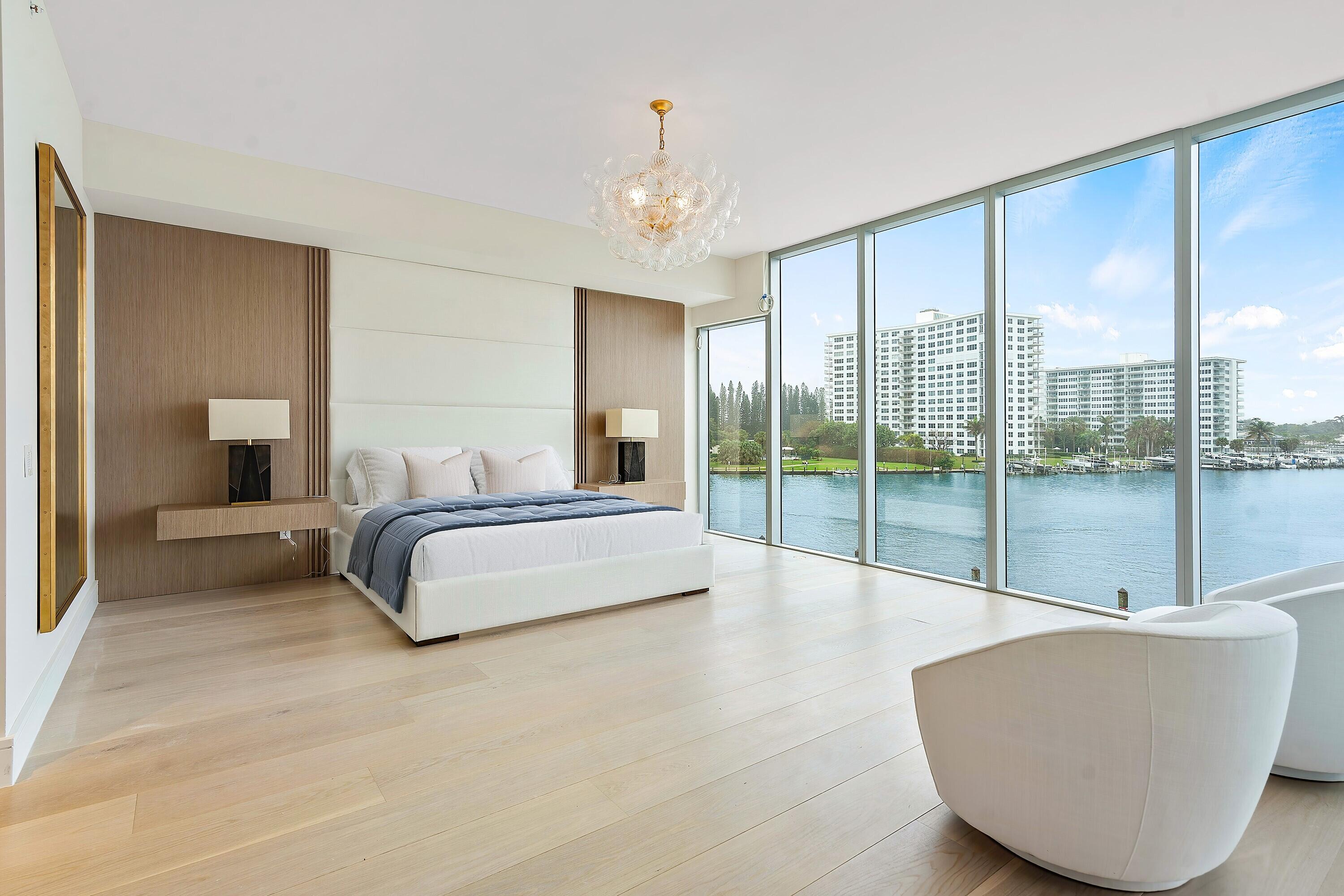 Introducing Unit 303, a brand-new condominium, a true trophy property situated in an unparalleled one-of-a-kind location at the extraordinary Boca Beach Residences, where luxury living meets breathtaking beauty. Nestled on Lake Boca Raton, this trophy property offers an unrivaled living experience defined by its spectacular water views and expansive living space spanning an impressive 4,328 square feet. This oversized unit boasts 4 bedrooms and 3.5 baths, providing ample space for comfortable living and entertaining. As you step into the master bedroom, prepare to be captivated by the floor-to-ceiling glass walls that showcase the magnificent views of Lake Boca Raton. Wake up to the gentle caress of sunlight reflecting off the tranquil waters, creating a serene and picturesque atmosphere that is truly awe-inspiring. The gourmet kitchen is a culinary masterpiece, equipped with top-of-the-line appliances including Gaggenau and Bosch appliances ensuring that every meal prepared here is a delight for the senses. The sleek design and high-end finishes create an atmosphere of elegance and sophistication, making it the ideal space for aspiring chefs and culinary enthusiasts. Upon entering the property, you are greeted by a magnificent entryway that sets the tone for the grandeur that awaits within. The seamless blend of beautiful porcelain and wood flooring throughout adds a touch of warmth and refinement to the living spaces, creating an inviting ambiance that invites you to relax and unwind. Every detail of this extraordinary property has been meticulously crafted to provide the utmost in luxury and comfort. From the exquisite finishes to the thoughtfully designed layout, no compromise has been made in creating a truly exceptional living space. Indulge in the epitome of waterfront living at the Boca Beach Residences, where panoramic water views, impeccable design, and world-class amenities converge to offer an unparalleled lifestyle. Experience the privilege of owning a trophy property that epitomizes the essence of luxury living in one of Boca Raton's most coveted locations.