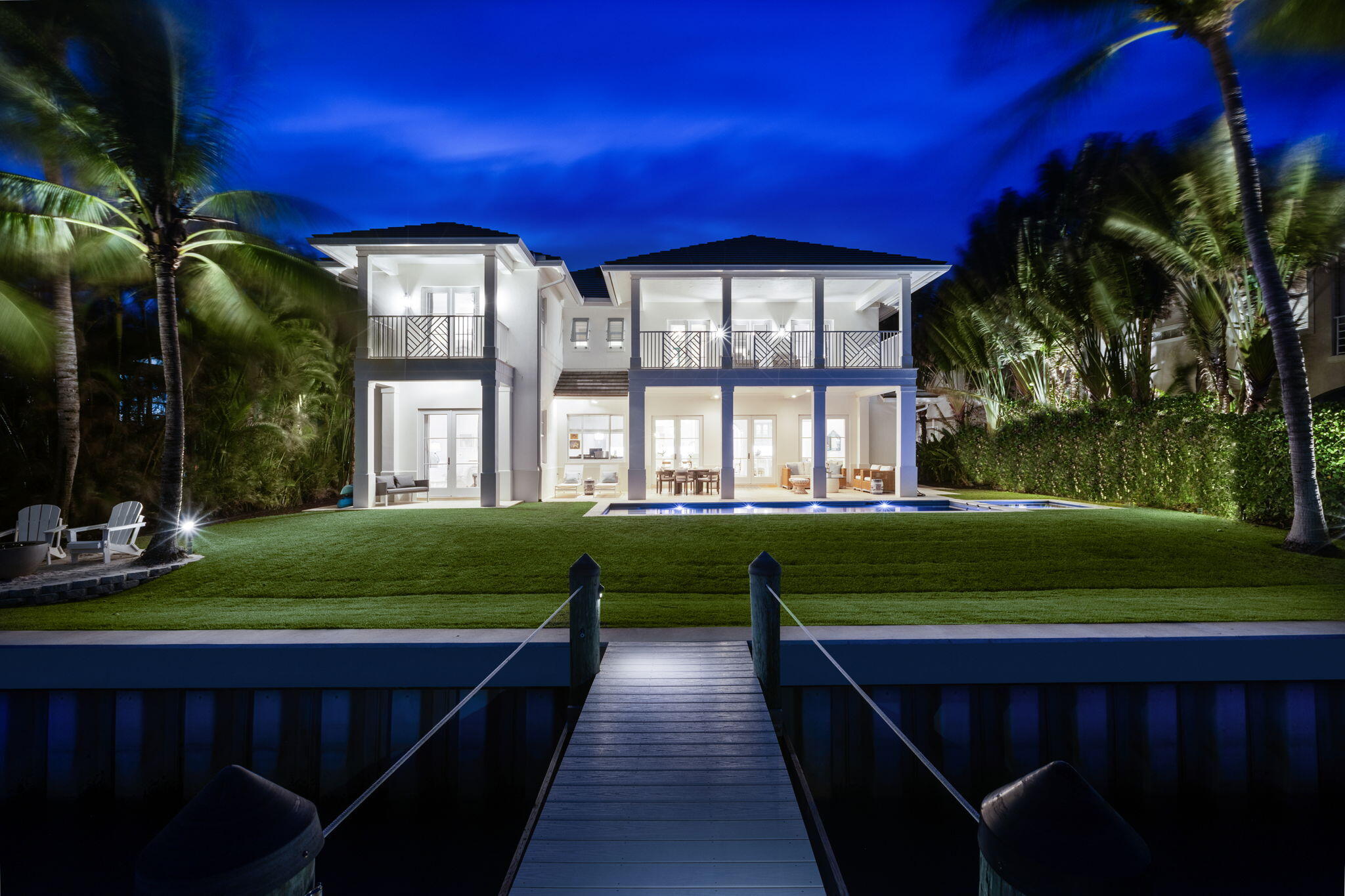 This custom waterfront home, situated on the turquoise Intracoastal near the Jupiter Inlet, offers a sublime coastal living experience.
Crafted by Onshore Construction and nestled at the end of a long private lane, this 4-bedroom, 4.5-bath haven offers a blend of luxury and privacy.
Boasting a 255-foot-long dock, stunning features such as white oak floors, Calcutta gold marble counters, dual dishwashers, and upstairs and downstairs laundries contribute to the convenience of daily living. With expansive views of the Bahama blue waters and no mangroves along the pristine seawall, the two-story residence delivers breathtaking moments from morning sunrises to evening skies.