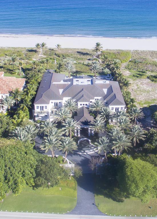 Inspired by the ocean’s splendor, the luxuries of a five-star resort, and the sensibilities of international modern design, this sublime masterwork harmonizes with the environment on 155± feet of oceanfront in the prestigious estate section of Delray Beach.  Orchestrated to engage the senses and indulge every desire, this sleekly elegant seven-bedroom showplace sprawls over a total of 31,786± square feet with an interplay of bold sculptural forms and serene water features both inside and outdoors, where glowing fire bowls add another elemental effect.***SEE SUPPLEMENT FOR ADDITIONAL INFORMATION AND DISCLAIMERS.*** Entrance gates glide open to the impressive motor court and porte cochere amid the gentle sounds of waterfall fountains.  An artistic tour de force, bringing in the spellbinding ocean view, the stunning entrance gallery has cantilevered glass-and-steel double staircases that frame a floating glass floor over a koi pond, giving way to the soaring atrium with its rippling two-story water walls and bamboo sculptures.  Open-concept living areas spill through view-filled window walls to the outdoor entertainment space by the immense lounge deck with infinity pool, staging an unforgettable experience for guests in this oceanfront dreamscape.  The fabulous "nightclub", hotel-inspired wine room, voluminous multi-room master retreat, and car collector's 10-bay garage are also among the sophisticated luxuries making this leading-edge abode second to none.  For those with a taste for the finest, this is the ultimate oceanfront paradise, one of the most extraordinary estates ever built in Delray Beach.

Location
South Ocean Boulevard, Delray Beach, Florida.  This sought-after oceanfront address in the estate section is only about a mile from famous Atlantic Avenue, offering fine boutiques and bistros in vibrant downtown Delray Beach.

Property
Stretching across 155Â± feet of dune-fringed sands, with a walkway to the beach, this sublime oceanfront estate was custom built in 2013 to exacting standards.  Medjool date palms and manicured gardens adorn the sweeping 1.7Â±-acre walled grounds entered through a gated motor court with sculpted waterfall fountains.  An idyllic resort-like realm for large-scale entertaining, the well-secluded oceanside grounds encompass a sprawling lounge deck with curvilinear infinity pool and spa among palm trees, fire bowls, and fountains.  The lanai is served by an outdoor kitchen with bar.  The poolside cabana/spa retreat provides a fitness room, massage room with jetted tub, steam room, cold plunge tub, and full and half baths.

Residence
Spellbinding ocean views are at one with the stunning modern design of this livable work of art comprising a grand total of 31,786Â± square feet with seven bedrooms, nine full baths, and five powder rooms.  Two glassed elevators serve all three levels which include a 10-bay garage with motorized turntable.  Amenities feature impact-glass windows, a copper roof, commercial-grade whole-house generator, high-tech Crestron home automation including comprehensive audio/visual systems, and an elaborate security system.

First Floor:  At the porte cochere, double doors enter the 25Â±-foot-high, limestone-floored gallery foyer that creates a dramatic overture to the main living spaces with its glass-bridged koi pond between loft-style glass-and-steel double staircases.  Powder rooms are on either side.  Ocean views open through the soaring atrium set off by a gridded window wall and sensational two-story, double-sided water walls between bamboo sculptures.  Flowing off the atrium, sharing a water wall, the salon is a spectacular two-story window-walled space that leads out to the oceanfront lanai and is dominated by a streamlined stone-and-steel ribbon fireplace by the piano alcove.  Also leading to the oceanfront lanai, the handsome bookcase-lined, double-height library gives clean modern refinement to the classic feel of rich wood paneling, and has herringbone hardwood floors and spiral stairs to the balcony level.  Below a back-lit floating ceiling, the fabulous club room features a professional-style, back-lit glass bar along a leather-finished wall, and also has a lounge area and surround-sound system.  Across the atrium from the salon, also sharing a water wall, the elegant oceanfront dining room has limestone floors, striking leather-and-wood accents, and recessed lighting.  Next to the glass-encased, 750Â±-bottle wine room, the butler's pantry connects into the epicurean's kitchen, an artful blend of form and function with sleek furniture-like cabinetry, Caesarstone counters, and high-end stainless steel appliances.  Served by a wet bar with curvilinear counter, the casual living/dining room is wrapped with gridded window walls joining to the oceanfront lanai.  Opening to an oceanfront patio, the VIP guest suite provides a living room with morning bar, a bedroom with onyx ribbon fireplace, and a marble bath with sculptural soaking tub and glassed shower.  The self-contained staff suite has a living room, working kitchen, and two bedrooms with baths.

Second Floor:  From the dramatic bridge gallery, double doors enter the voluminous master suite's private salon appointed with rich hardwood floors, a morning bar, and a romantic fireplace framed in a hardwood mantel topped by a mirror reflecting the ocean view.  Showcasing the serene ocean vista, glass doors open to an enormous wraparound terrace from here and from the master bedroom with curvilinear, back-lit glassed bed alcove and sitting area.  This sumptuous sanctuary also features two spa-like baths with jetted/soaking tubs, glass-enclosed showers, and separate water closets.  Two exquisite walk-in closets are fashioned as boutique-style wardrobe rooms with sleek custom built-ins and specially designed lighting.  Placed apart from the master quarters, three luxe guest bedrooms with distinctive dÃ©cor and private baths are arranged in two suites, both with living rooms.  A laundry room completes this level.

Lower Level:  Entered from a lobby with powder room, the professional-style theater is calibrated to industry-leading standards and features a 2D/3D projector, JBL surround-sound system, reclining leather seating, and a refreshment bar.  Another wing contains a laundry room, multi-purpose room, and powder room.

***DISCLAIMERS***The information herein is deemed reliable and subject to errors, omissions or changes without notice.The information has been derived from architectural plans or county records. Buyer should verify all measurements.Property is being sold unfurnished.  No artwork is included in the sale.

Disclaimer: The information provided herein including but not limited to measurements, square footages, lot sizes, calculations and statistics have been obtained and conveyed from third parties such as the applicable Multiple Listing Service, public records as well as other sources. All information including that produced by the Sellers or Listing Company are subject to errors, omissions or changes without notice and should be independently verified by any prospect for the purchase of a Property.  The Sellers and Listing Company expressly disclaim any warranty or representation regarding all enclosed information.  Prospects' use of any information herein is acknowledgement of this disclaimer and that Prospect shall perform their own due diligence.  Prospects shall not rely on this information when entering into a contract for sale and purchase.  Some affiliations may not be applicable to certain geographic areas. If your property is currently listed, please do not consider this a solicitation.   In the event a Buyer defaults, no commission will be paid to either Broker on the Deposits retained by the Seller. "No Commissions Paid until Title Passes."    Buyer pays title insurance, Florida documentary stamps, and all other closing costs for New Construction and land use. Copyright 2016 Listing Company.  All Rights Reserved.