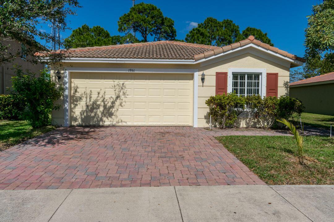 Spacious 4-bedroom, 2-bath home located in the desirable Newport Isles community. This home features tile flooring throughout the main living areas with carpet in the bedrooms, along with window treatments already in place. Both bathrooms offer convenient tub and shower combinations. The home also includes an indoor laundry room for added convenience. Great opportunity to make this property your own — being sold as-is.