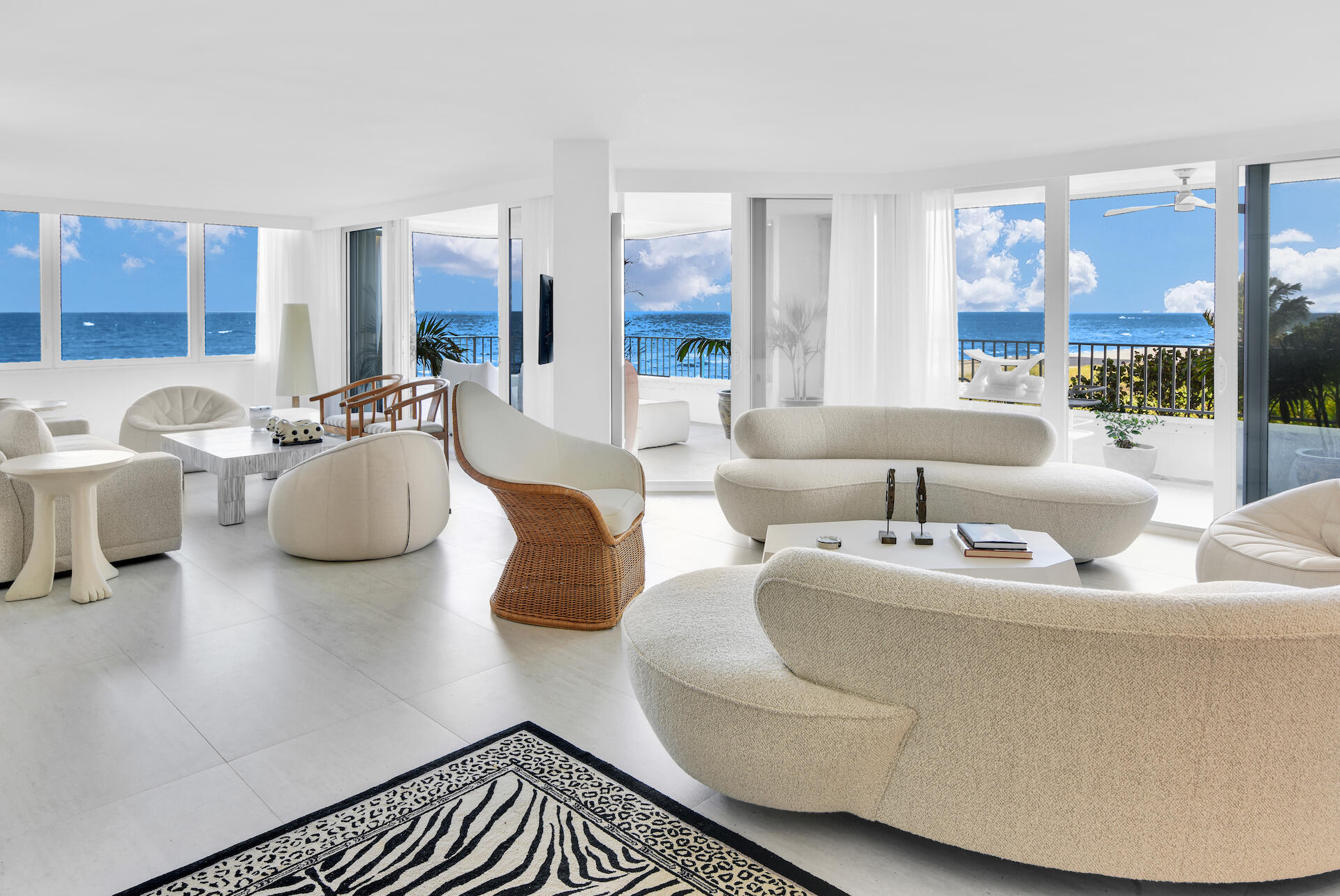 Step into a world of luxury with this extraordinary 3,000 sq ft beachfront residence with direct, panoramic ocean and beach views. Featuring two expansive east and south facing terraces with 700 sq ft of outdoor space, you'll be able to witness awe-inspiring sunrises, perfect for dining or lounging. Inside this magnificent residence, everything has been completely remodeled and meticulously designed with custom high-end details. The interior effortlessly combines modern sophistication with a warm, inviting ambience, making it the ideal seaside sanctuary. 3 generously-sized bedrooms, a den and a family room, ensuring every member of the family has their own private space. This home is truly a dream come true for the most discerning buyers who appreciate the finer things in life.
