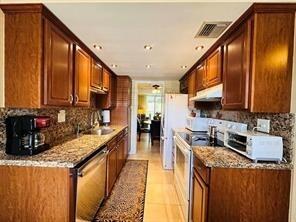 Fully furnished and move-in ready, this beautifully updated turnkey unit offers the comfort and convenience you've been looking for. Ideally located just minutes from downtown, the beach, shopping, dining, and major highways. Renovated within the last three years, the home features a modern open-concept layout, updated kitchen, and a desirable split-bedroom floor plan for added privacy. Enjoy peaceful nature views from your living space while benefiting from a lightly used A/C and water heater. Every detail has been thoughtfully maintained, making this home truly ready for immediate occupancy. Don't miss this incredible opportunity! No leasing permitted during the first 2 years of ownership.