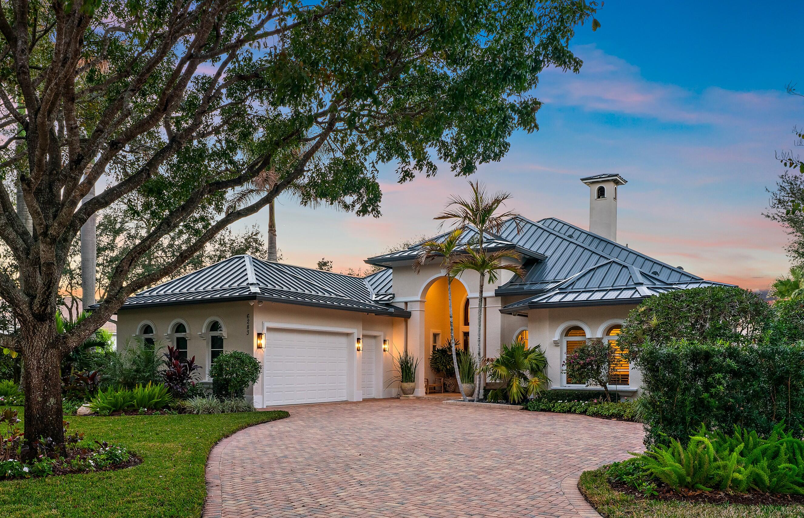 This is the one! An amazing transformation that took place in 2023/2024. New Roof, impact windows & doors and whole house generator. Complete decorator remodel of the entire home. Each room thoughtfully designed to offer a sophisticated serene environment. Large primary with sitting area and oversized bath. An additional 1/2 lot combined on title provides endless opportunity. Extra garage, guest house or just the beautiful garden it is now. The 2500 sq. ft. outdoor space is anchored by a 30x15 completely refurbished pool and pool deck. A newly built summer kitchen and covered dining area provides the perfect place to host a large group or intimate dinner party.   Medalist Village is where you can enjoy golf, dining, tennis, spa & fitness just steps or a golf cart ride from your front door