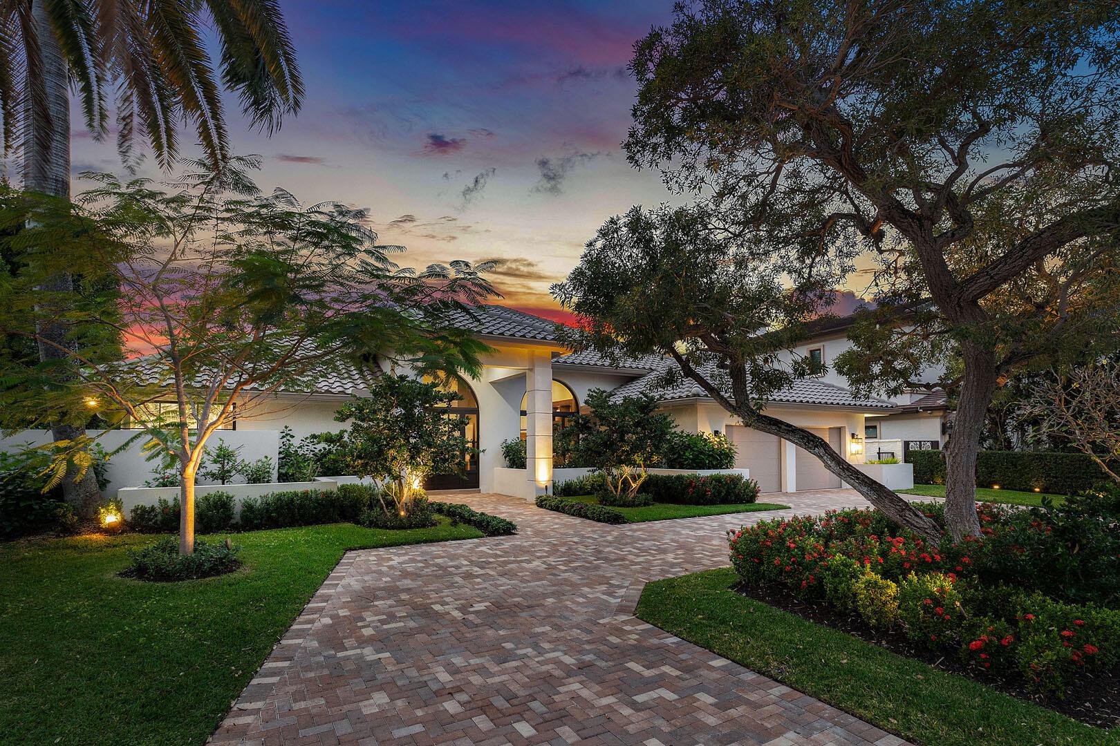 Experience the pinnacle of modern living in this fully renovated, single-story home in the prestigious Royal Palm Yacht & Country Club. Completely reimagined for both comfortable living and style, the gorgeous home features a split floor plan with four generously sized bedrooms, including a spacious master suite with a private sitting area and a fabulous spa-inspired bath. The heart of the home is the chef's kitchen, which boasts exquisite quartzite countertops, premium Thermador appliances, a morning bar, and thoughtful design elements ideal for culinary pursuits or casual entertaining. Adjacent to the kitchen, the formal dining room is enhanced by designer lighting and custom storage and offers an elegant space for hosting gatherings. Step outside to your private retreat, where a heated free-form pool, stone tile deck, and covered patio create the perfect setting for relaxation or entertaining. An additional office/bedroom with a built-in partner desk and en-suite bath provides flexibility for work or guests. Updated conveniences include natural gas, a full-house generator, and impact glass windows and doors, ensuring peace of mind and energy efficiency. This new and improved home blends timeless elegance with contemporary design in one of South Florida's most sought-after communities.