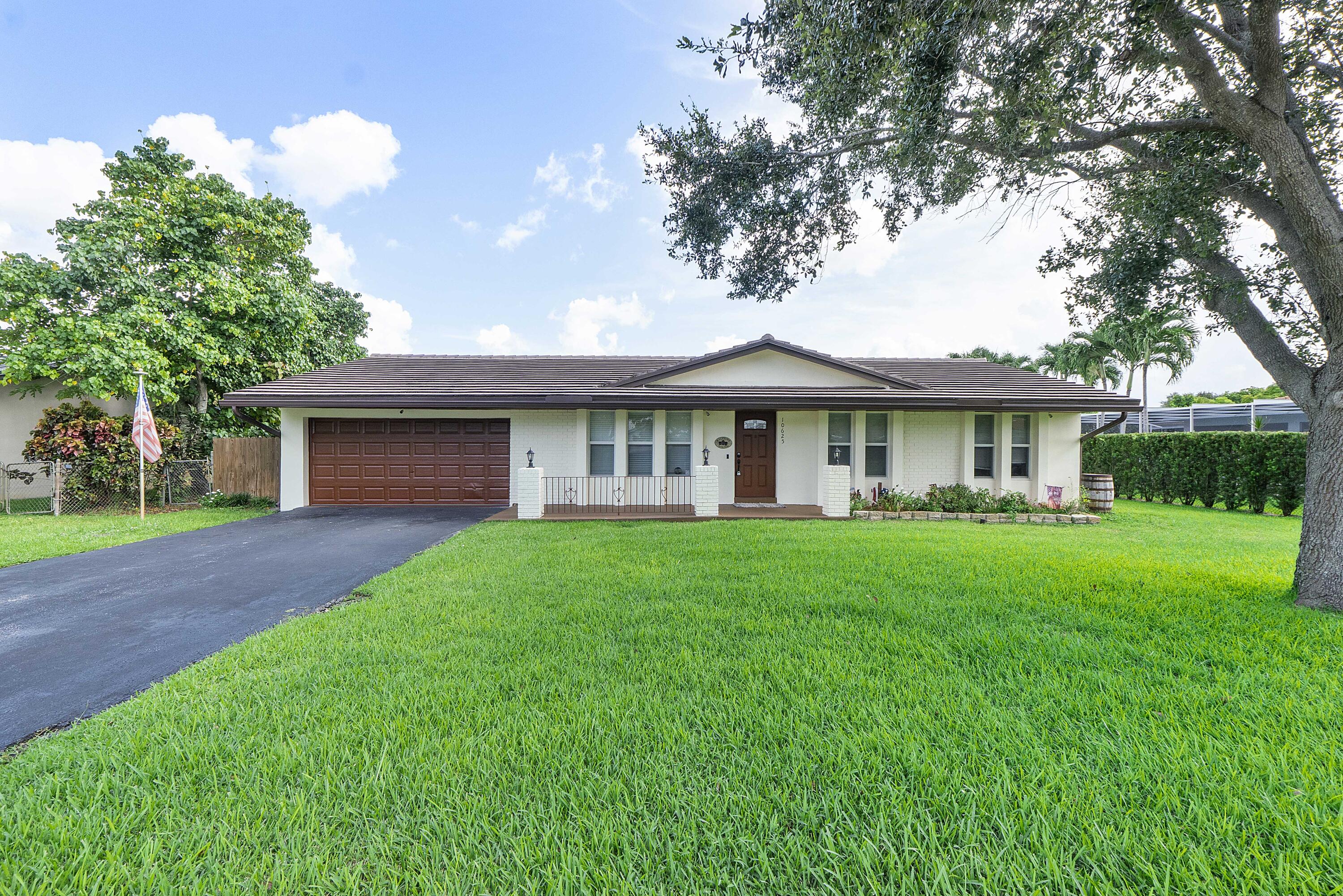 Don't miss this beautifully updated 4-bedroom, 2-bath pool home situated on an oversized 0.33-acre lot in a highly desirable Coral Springs location. Offering exceptional value and move-in-ready condition, this home features numerous recent upgrades throughout.  Highlights include: Updated kitchen and bathrooms, Roof and gutters, Complete impact windows and doors, pool resurfaced with updated tile, new laminate flooring and baseboards, Elec. panel,  W/D, A/C The spacious backyard provides plenty of room for entertaining, relaxing by the pool and enjoying South Florida living. With no Hoa restrictions and prime central location to all shopping/Dining.