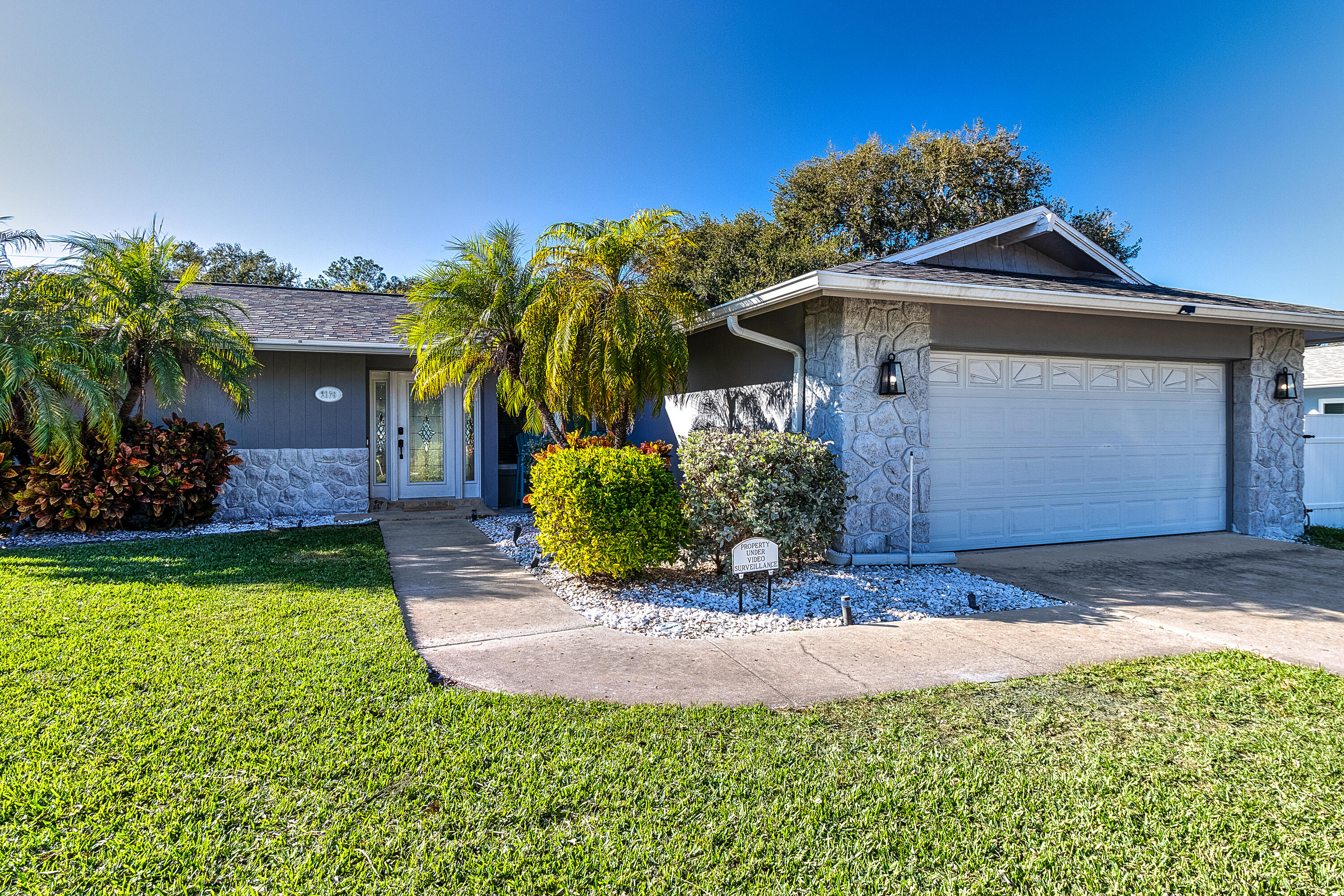 Move-in ready pool home on an oversized lot in desirable Fairway Estates, minutes to Honeymoon Island! This 2-bedroom, 2-bath ranch-style home features a split bedroom layout, abundant natural light, and spacious living areas. Enjoy Florida living with a private gunite pool, covered patio, and vinyl fenced backyard. Recent updates include a 2021 roof. Block construction, 2-car garage, central A/C, and no HOA. Located near downtown Dunedin, the Pinellas Trail, golf, shopping, and dining. A rare opportunity on nearly 1/3 acre! Add-Ons:  Roof replaced 2021; HVAC 1 year warranty; water heater 2025