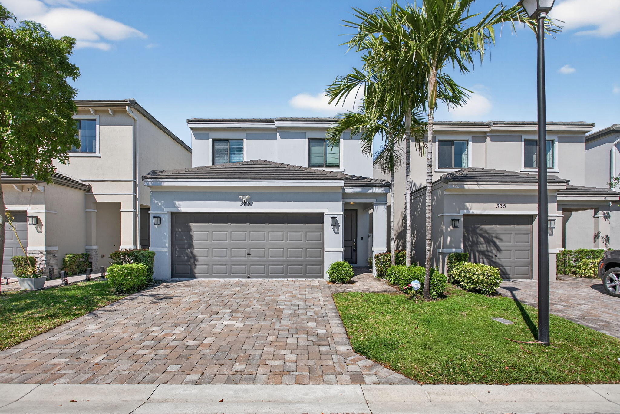 Seller is offering 5k towards buyer closing cost.Experience elevated living in this sophisticated 3-bedroom, 2.5-bath residence built in 2021, located within a private gated community in Pompano Beach. Designed with modern elegance, this home features an open-concept layout, 9-foot ceilings, impact windows and doors, and a spacious 2-car garage. Freshly painted, it offers a clean, move-in-ready feel. The contemporary kitchen seamlessly integrates with the living and dining areas, ideal for both everyday living and entertaining. The second bedroom includes a custom Murphy bed, adding flexibility and function. Step into a fenced backyard with tranquil lake views—an ideal setting to unwind. Ideally located near major highways, shopping, and dining. Could this be the one that truly feels right