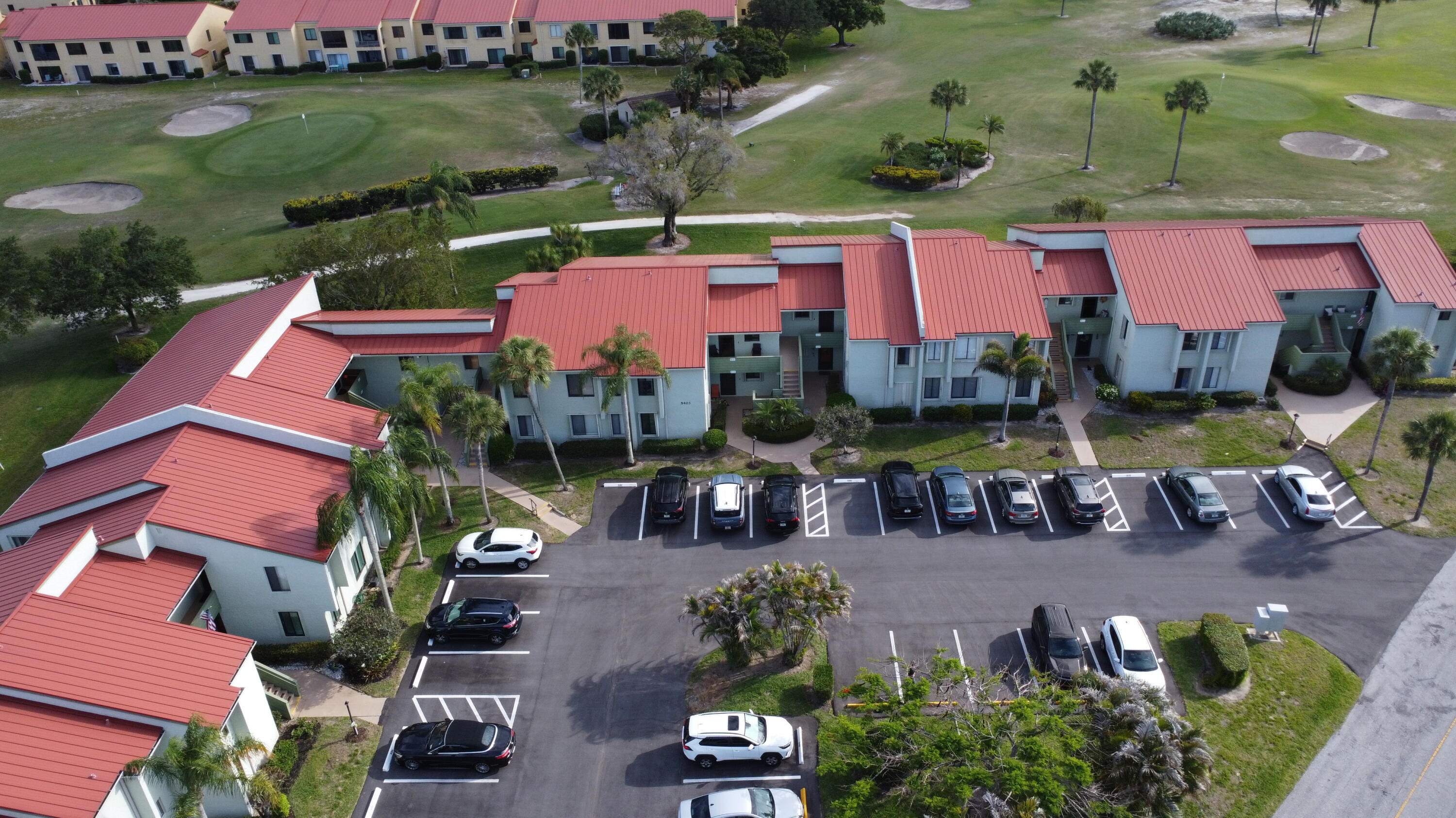 Wonderful first-floor 2-bedroom, 2-bath condo in the desirable 55+ community of Miles Grant. This light and bright unit offers true ground-level living with assigned parking directly in front of the unit for ultimate convenience. Hurricane Impact windows and doors through out the Condo. Updated bathrooms, ceramic tile flooring throughout, a fully enclosed lanai and private patio overlooking the golf course—perfect for morning coffee or relaxing evenings. The home also features newer A/C, water heater, dishwasher, and washer/dryer. Miles Grant is an active and welcoming community located near the Intracoastal Waterway in Stuart. Residents enjoy a community pool and a mandatory social membership to Miles Grant Country Club, offering options and a wide range of amenities including pickleball