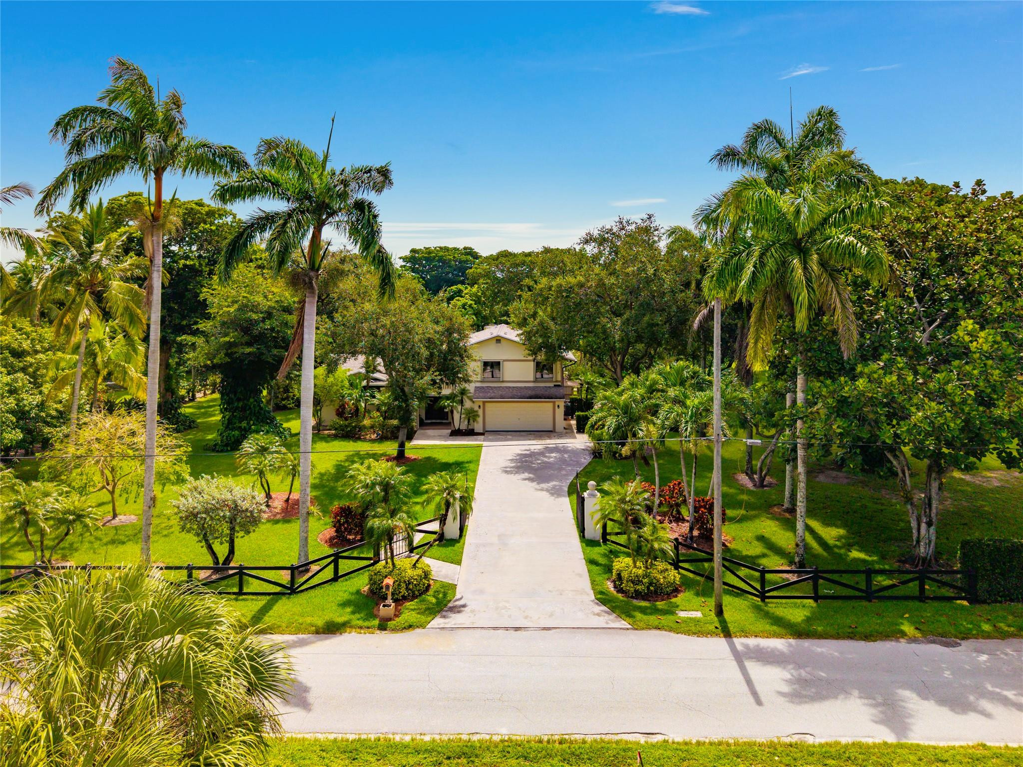 A perfect blend of peaceful country living and everyday convenience in this beautifully maintained 4/3 home, set on 2.5 acres of lush, landscaped grounds with mature fruit trees and open green spaces. This private retreat offers tranquility just minutes from top-rated schools, shopping, and dining. Ideally located only a quarter mile from Barkland Dog Park and the Parkland Equestrian Center. Note: on-premises stables are not included but negotiable in rental. Spacious living areas with generous natural light, a well appointed kitchen ideal for cooking and entertaining, and a seamless flow between indoor and outdoor living. Step outside to enjoy your own heated pool, perfect for relaxing or hosting friends year-round. This Parkland gem offers comfort, charm, and a lifestyle you'll love!