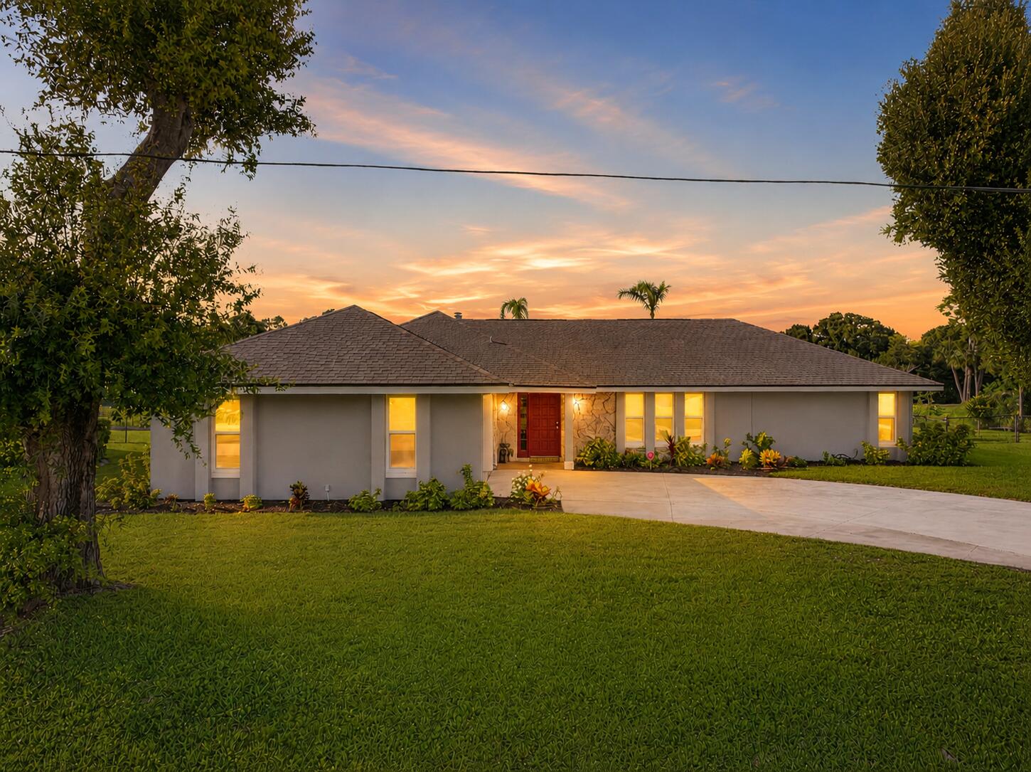 Offered below appraised value! Experience the best of Florida living with panoramic golf course views in this beautifully maintained pool home overlooking the golf course with a tranquil canal buffer for added privacy. Inside, vaulted ceilings, a striking floor-to-ceiling stone fireplace, and an open-concept layout create an inviting space for everyday living and entertaining. The kitchen features granite countertops, rich wood cabinetry, and stainless steel appliances (2022). Enjoy Florida living year-round from the expansive screened lanai with outdoor bar and sparkling pool. Major updates include Roof (2024), HVAC (2025), Water Heater (2025), Pool Pump & Filter (2024), Patio Screens (2025), and an updated primary shower (2026).