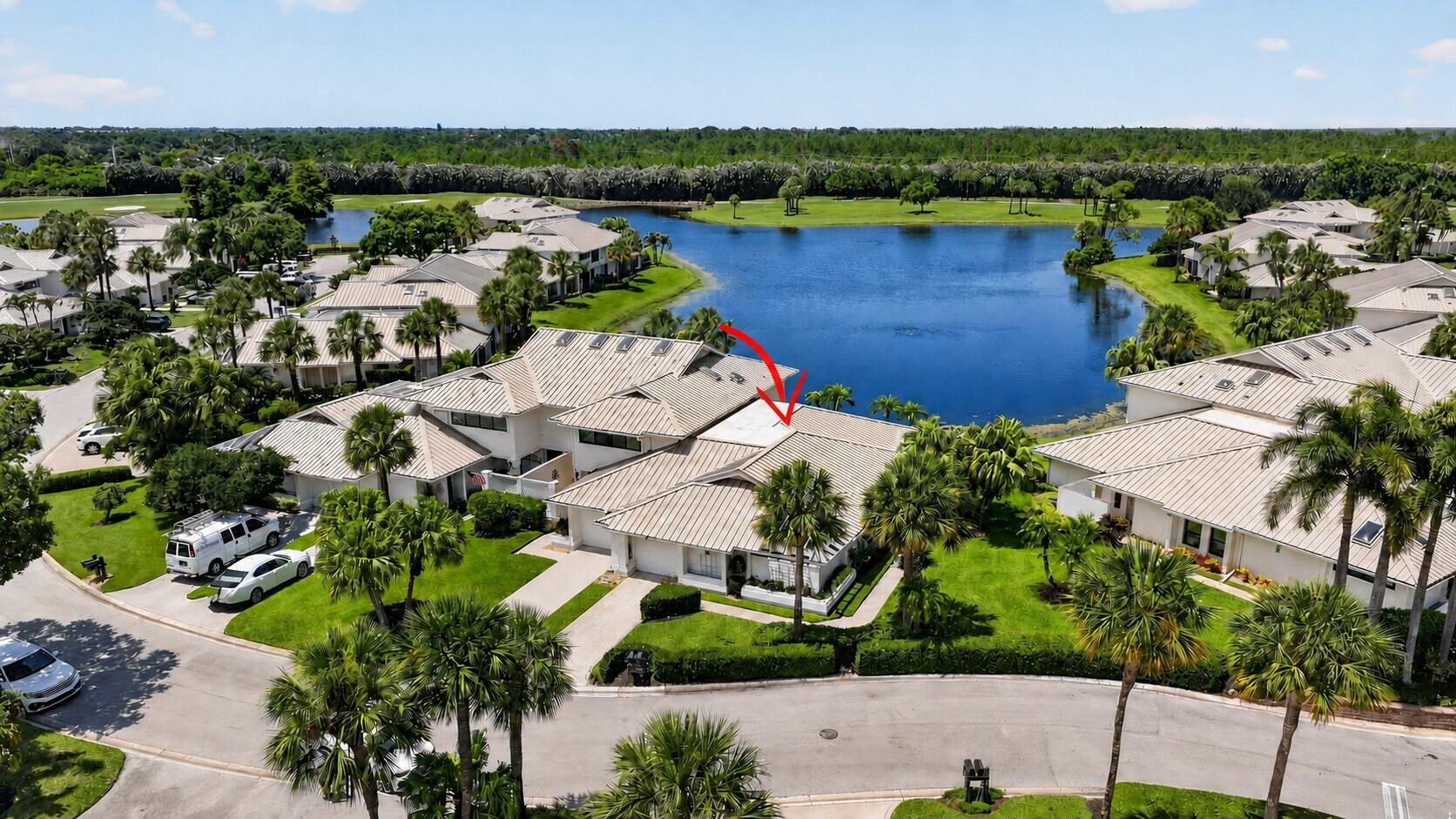 Beautifully renovated Move-in Ready condo in Mariner Sands Country Club, a premier golf community on the Treasure Coast! This coastal-inspired single-story corner unit offers expansive water views and effortless Florida living. Featuring 2 bedrooms, 2 bathrooms, and a unique floor plan with additional square footage, this special model includes a versatile bonus room ideal for a den or office. The stunning renovated kitchen showcases gorgeous quartz countertops, a striking Italian tile backsplash, modern appliances and hardware, and an open layout that flows seamlessly into the dining and living areas—perfectly positioned to capture spectacular water views. Custom cypress ceilings, oversized 24" x 24" marble-look tile flooring, and 5" crown molding. The spacious primary suite offers a large custom walk-in closet and a beautifully renovated bath featuring double vanities, a garden tub, and separate walk-in shower. Step outside to your own private retreat with new weatherproof decking and a charming trellis just off the primary bedroom—perfect for morning coffee or quiet relaxation. Additional highlights include accordion storm shutters, outdoor seating area, A/C and water heater replaced in 2025, newer washer/dryer.  Garage is suitable for storage, golf cart, bikes.  Foxcross residents pay $6,500 annually for property maintenance which includes roof, exterior walls, irrigation, landscaping, pest control, driveways, walkways and pool.   Mariner Sands offers two championship 18-hole golf courses, Har-Tru tennis courts, pickleball, croquet, and a state-of-the-art fitness center. The community also features a resort-style pool with a separate lap pool, along with the Sand Bar offering exceptional indoor and outdoor casual dining. The spectacular new clubhouse provides both fine and casual dining, along with weekly social events and happy hours. Additional amenities include a dog park, playground, spa, and nail salon—all just minutes from pristine beaches and charming downtown Stuart. Social membership is required with a one-time capital contribution of $50,000 due at closing. Golf membership is separate and optional.
