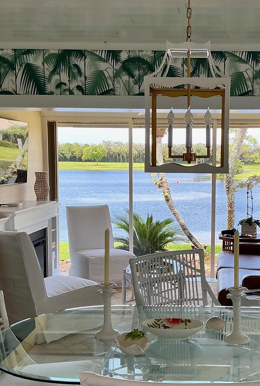 Professional Photos Coming Soon! Beautifully renovated Move-in Ready condo in Mariner Sands Country Club, a premier golf community on the Treasure Coast! This coastal-inspired single-story corner unit offers expansive water views and effortless Florida living. Featuring 2 bedrooms, 2 bathrooms, and a unique floor plan with additional square footage, this special model includes a versatile bonus room ideal for a den or office. The stunning renovated kitchen showcases gorgeous quartz countertops, a striking Italian tile backsplash, modern appliances and hardware, and an open layout that flows seamlessly into the dining and living areas—perfectly positioned to capture spectacular water views. Custom cypress ceilings, oversized 24" x 24" marble-look tile flooring, and 5" crown molding. The spacious primary suite offers a large custom walk-in closet and a beautifully renovated bath featuring double vanities, a garden tub, and separate walk-in shower. Step outside to your own private retreat with new weatherproof decking and a charming trellis just off the primary bedroom—perfect for morning coffee or quiet relaxation. Additional highlights include accordion storm shutters, outdoor seating area, A/C and water heater replaced in 2025, newer washer/dryer.  Garage is suitable for storage, golf cart, bikes.  Foxcross residents pay $6,500 annually for property maintenance which includes roof, exterior walls, irrigation, landscaping, pest control, driveways, walkways and pool.   Mariner Sands offers two championship 18-hole golf courses, Har-Tru tennis courts, pickleball, croquet, and a state-of-the-art fitness center. The community also features a resort-style pool with a separate lap pool, along with the Sand Bar offering exceptional indoor and outdoor casual dining. The spectacular new clubhouse provides both fine and casual dining, along with weekly social events and happy hours. Additional amenities include a dog park, playground, spa, and nail salon—all just minutes from pristine beaches and charming downtown Stuart. Social membership is required with a one-time capital contribution of $50,000 due at closing. Golf membership is separate and optional.