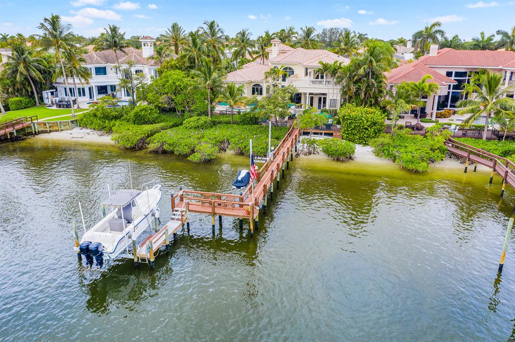 COME SEE THIS CASSEEKEY ISLAND GEM! This sought-after location in one of Jupiter's top selling, non-mandatory club, communities is a private enclave of 63 homes on navigable salt water. Jonathans Landing has a 24 hour manned gate and endless club amenities. Close to all Jupiter has to offer; restaurants, shops and some of the finest beaches in Palm Beach County. This Traditional style home sits on 100 ft of waterfrontage, complete with 4 bedrooms, 6.5 bathrooms, large ground floor master suite with His/Hers closets, den, kitchen, remodeled in 2018 with top of the line appliances. Exterior Features include a private pool, spa, fire pit, cabana bath, outdoor shower, large deck with custom lighting, 2 covered balconies, 1 open balcony facing West (for the sunset watchers). (See Supplementa The best part is being able to launch your paddle board/kayak from your private beach right next to the 105 foot fingerling dock complete with two jet ski lifts and a 12,000lb lift to accommodate up to a 38 foot boat. Come live in paradise!!