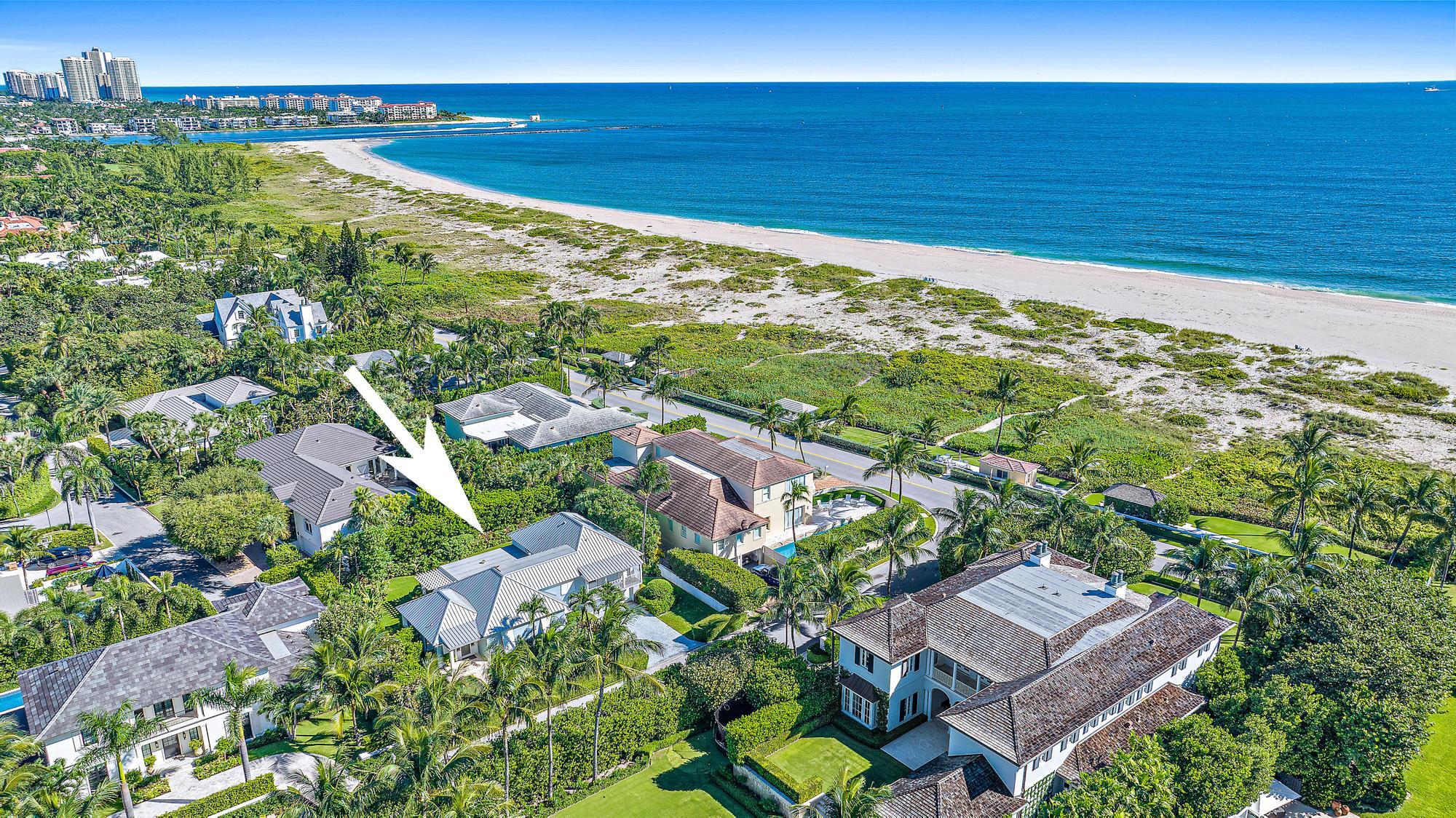 Rare north-end 4 BR, 3.1 BA, with 2-car garage offering an easy laid-back opportunity to embrace Palm Beach's unique tranquility only one house away from the ocean & close Bike Trail access.  Relax in the covered-loggia or the nearby shared oceanfront cabana with a covered area, patio furniture, fire pit & running water. This home is on one of the highest elevations on Reef Road. Move-in ready with a new primary bath & impact windows.  Should you prefer to renovate more fully, the property includes Architectural Com. (ARCOM) approved plans by Tralango & Taylor including a bar, gym, 50' lap pool, outdoor fireplace, landscaping & other luxury features. The north-end is home to the quietest beaches on Palm Beach & is only a 10 minute drive from The Royal, Worth Ave., restaurants & markets.