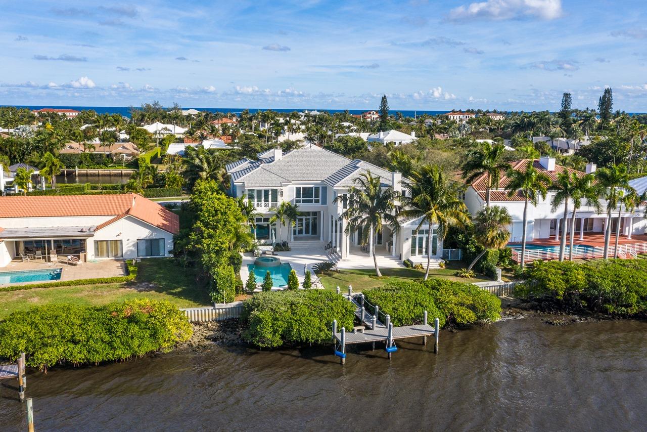 Enjoy this spectacular & secluded waterfront home on  Point Manalapan! This  7,800 sq. ft. 2 story,  6 bedroom, 7.5 baths home offers you the best of South Florida waterfront living. Located in a very exclusive area this home features sensational sunsets and incredible views across your waterfront dock and new seawall located in the wide section of the Intracoastal Waterway. The deep water dock is nestled in the tranquil Intracoastal waters surrounding the Point and can accommodate up to a 25' boat and provides an easy and relaxing short ride to the open ocean. The grand two story entrance foyer sets the stage and welcomes you to an open floor plan bathed in warm natural light. This spacious home offers dramatic custom lighting, cathedral, vaulted and volume ceilings and double height walls. Your guests can move easily from the living room with its inviting fireplace to the fabulous views from the family room and the adjacent formal dining room or to the den/office, and all with lovely views of the lushly landscaped yard and pool area. 
The fantastic dine-in gourmet kitchen has a commercial 8-burner hooded gas range, a large center island prep and cook area with stainless steel sink, and a second counter with stainless steel sink that has a breakfast bar with barstool seating for four from the family room side of the kitchen that is also perfect for serving hors d oeuvres and drinks in the adjacent, spacious family room with its large wet bar
There's an elevator that takes you up to the oversized master bedroom suite with large custom walk-in closets, a custom tongue-in-groove cove ceiling over the bed area and has both a sitting room and lounging area with wet bar steps from the walkout balcony overlooking the waterfront. The en-suite bathroom with marble flooring has a custom tub and an oversized dual-head shower.
 
The covered patio features a full summer kitchen with hooded gas grill, and the uniquely designed in-ground Gunite salt water pool with custom over-flow Jacuzzi spa.  Other amenities include a circular drive, 3 car garage, fence, lake/canal sprinkler system and storm shutters.
 
Manalapan home ownership and residency comes with a gratis membership to the La Coquille Club, a cherished part of the Manalapan experience. Members are granted access to the club's many amenities, including pool, spa, private beach, tennis, golf, a business center, fitness and club room. Members are not charged initiation or fees and are billed only for the goods and services enjoyed while at the club.
Additional advantages to living in Manalapan are the town's police force, the nearby library and the lowest property tax base in Palm Beach County. All of this is within a few minutes' drive of some of south Florida's best upscale shopping and dining.
 
If luxury, lifestyle, and fantastic amenities are what you want at an incredible price, go south a few miles from Palm Beach and invest the time to see this home for yourself. This is the ultimate in waterfront estate living at a price far below anything remotely comparable in the south Florida area.