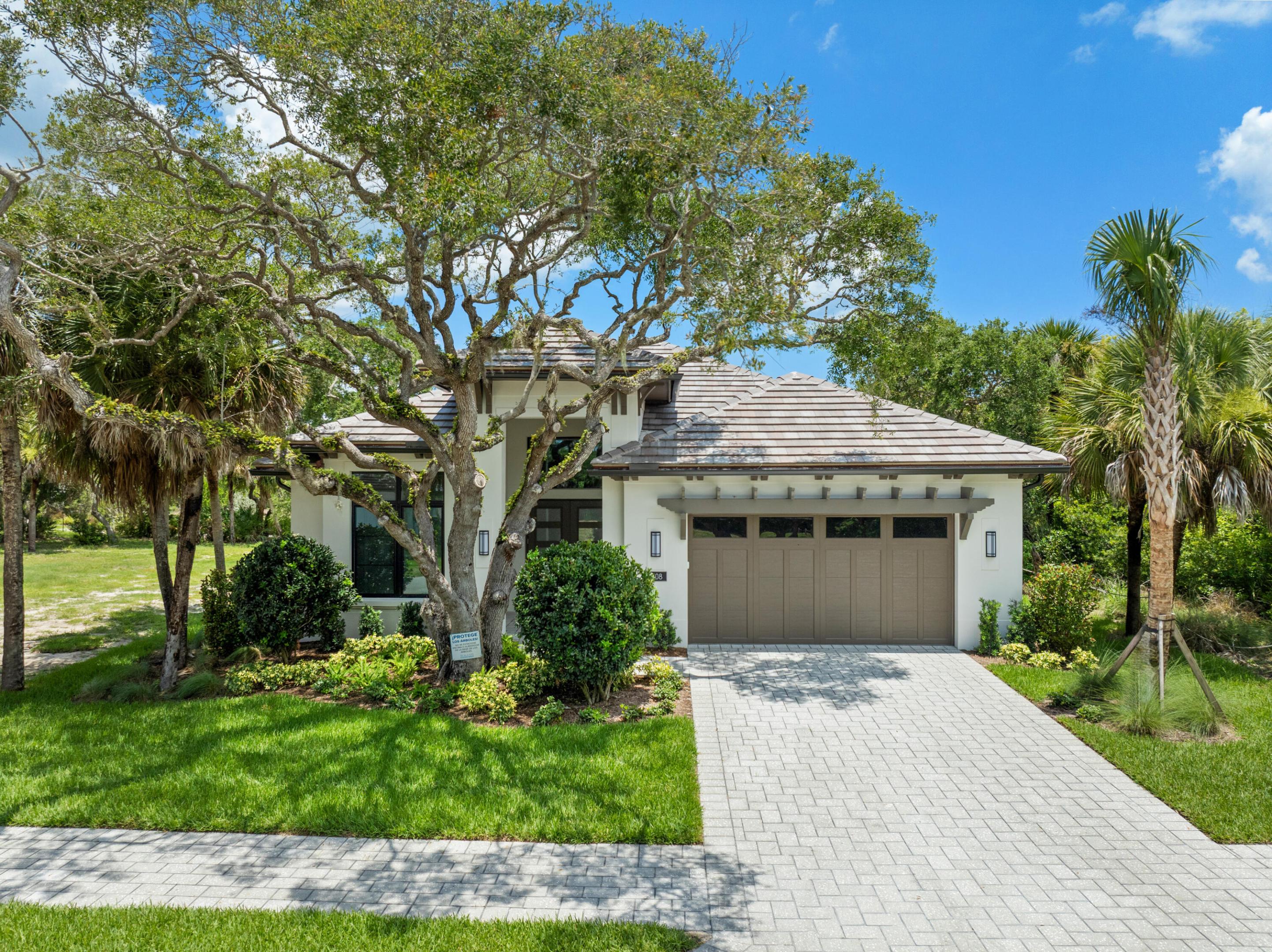 The Cerulean Grand featuring high-quality finishes, offering 4 bedrooms, 3 full baths, + a powder bath. It is a short walk to the community beach house. Amenities include stacked kitchen cabinets & white Monogram/Café appliances, including double ovens, a microwave drawer, a built-in cabinet-panel refrigerator, and a commercial-grade natural-gas cooktop. The great room, dining area, & foyer feature coffer ceilings w/ wood detailing & a linear fireplace w/ floor-to-ceiling tiled surround. The backyard is designed for entertaining, complete w/ a pool, including a sun shelf & a raised water feature. The patio & pool deck are screened.