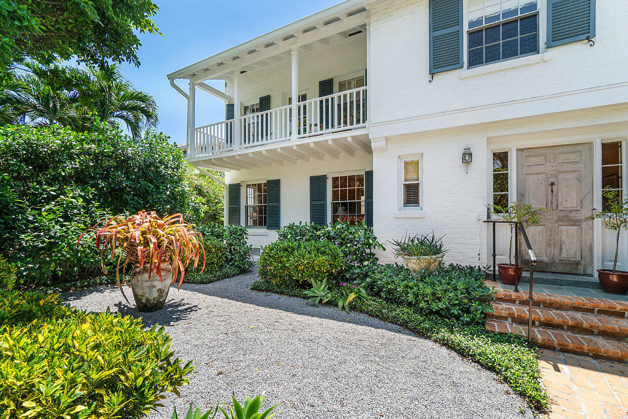 Classic Palm Beach Home located one property from the Ocean. With three bedrooms, three and one half bathrooms in the main house, this residence, named ''Whirlwind'', boasts the gracious proportions only found in the iconic architecture of its time. Greeted by a formal foyer and sweeping staircase, the home leads into living spaces wrapped in oversized windows and natural light, generous ceiling heights, and ample balconies and sunrooms. The double Master Bedroom options both have private offices, offering flexible space to meet any Buyers needs. The separate garage and 1 Bedroom, 1 Bathroom guest cottage are excellent assets to the property. The 40 foot pool is ideal for laps with traditional gardens to complete the privacy and serenity of the space.
