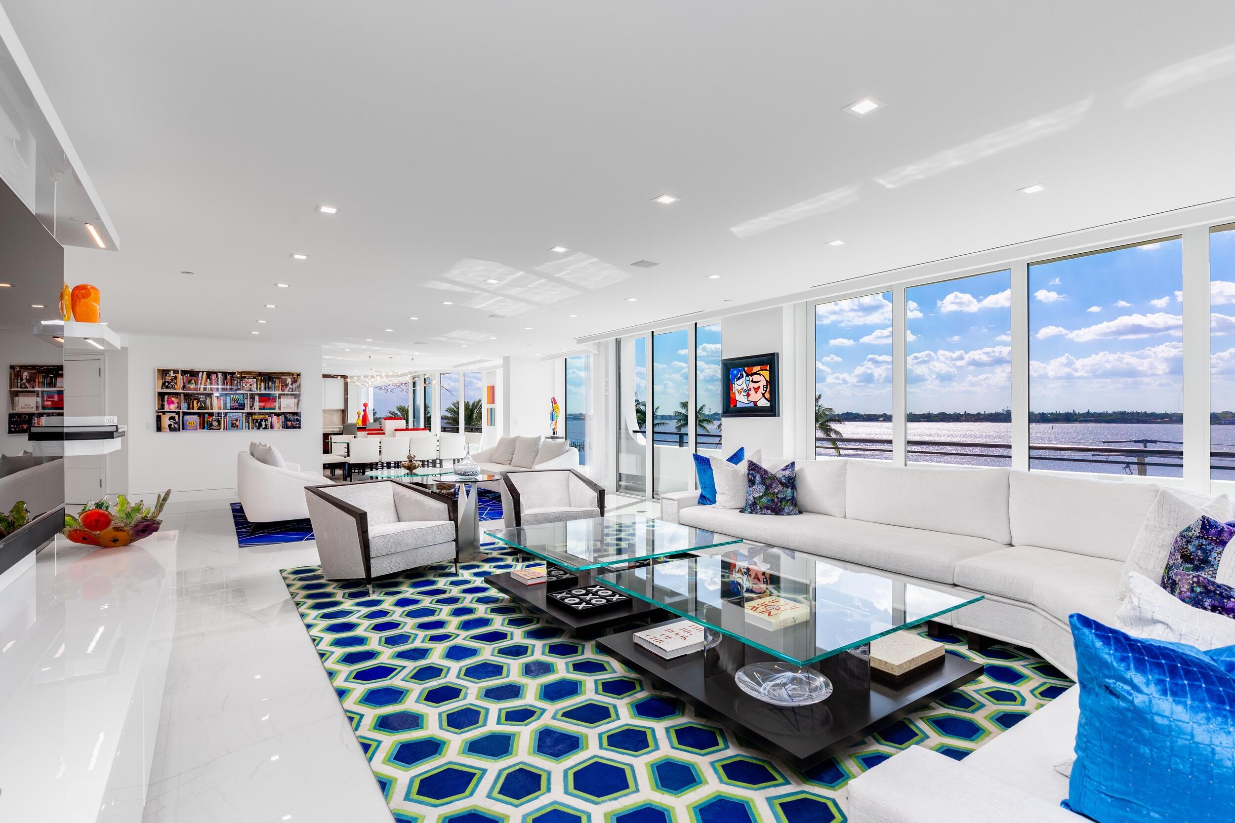 Expansive views of the Intracoastal & Ocean surround this extraordinary 5,000' residence. Comprised of 3 en-suite bedrooms with a convertible 4th, 2 office/dens, 400-bottle wine room, 4 full baths and 2 powder rooms. Gracious well proportioned rooms, volume ceiling heights with an abundance of natural light. Meticulous renovation with outstanding finishes that include custom cabinetry and lighting, motorized solar shades, digital sound/home system & abundant storage throughout. Luxurious Owners suite with dual baths, steam shower and large dressing rooms. Enjoy sunrise to sunset from either Ocean or Intracoastal balconies. The PB Hampton is a premier full service building offering 24/7 gatehouse, doorman, amazing fitness center, gorgeous pool deck, tennis, 2 assigned garage & pets friendly