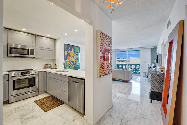 Completely renovated and move-in ready! This beautifully updated residence offers modern finishes throughout, creating a bright and inviting living space. The open layout is complemented by impact windows and two sets of impact sliding glass doors, which fill the home with natural light and provide seamless access to the spacious balcony. The stylish kitchen and updated bathrooms add to the home's contemporary appeal, making it ideal for year-round living or a seasonal retreat. Ideal location just minutes from beaches, shopping, dining, Gulfstream Park, Aventura Mall, and major highways. A turnkey opportunity you won't want to miss!