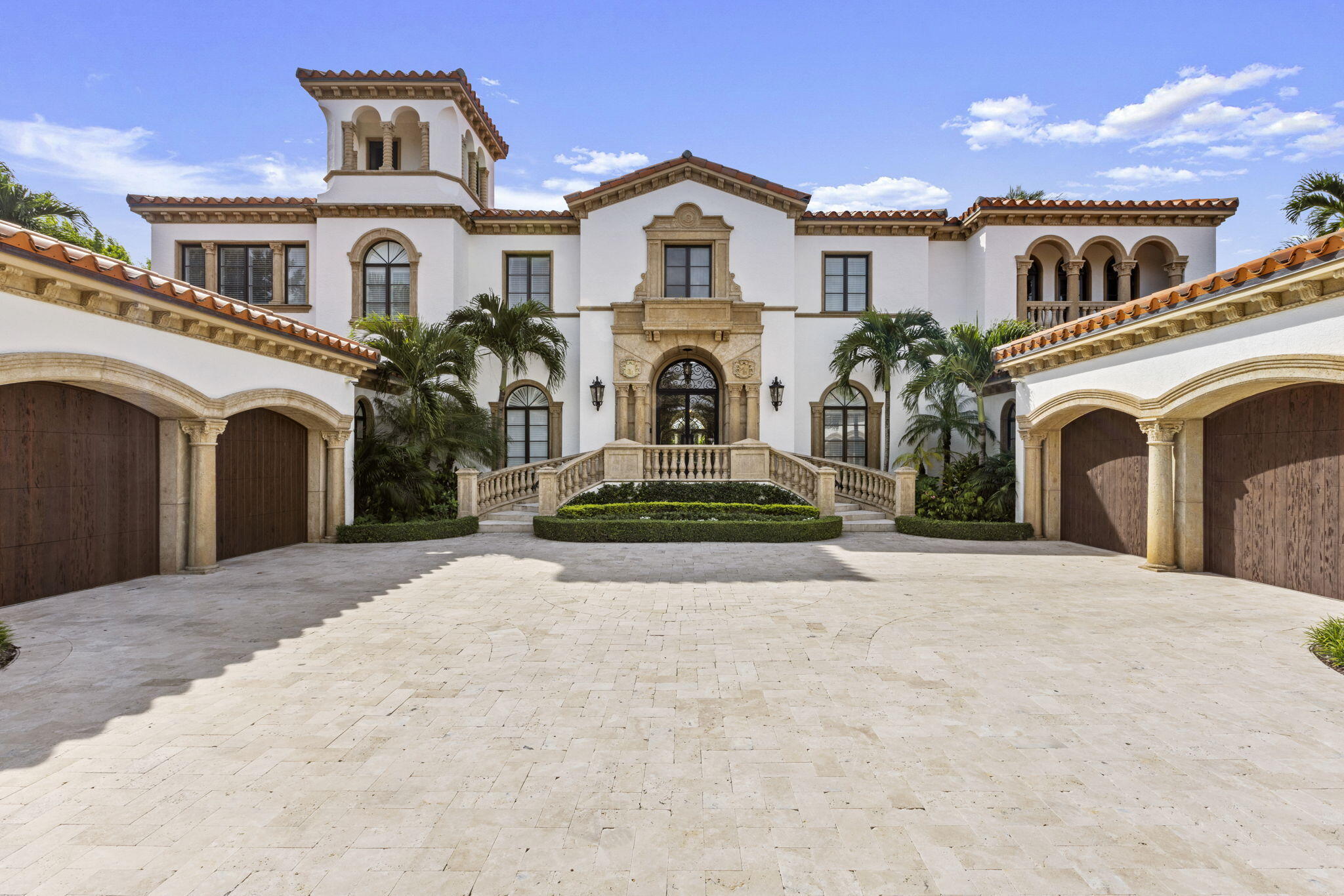 Discover the splendor of this updated Mediterranean home with a high elevation in the Estate Section, boasting a prime location near the ocean with deeded beach access. Set on a sprawling high elevation 3/4-acre plot, this magnificent residence offers an impressive eight bedrooms/nine bathrooms including separate guest house. Indulge in the luxury of a private home gym, wood-paneled library/office, and a primary bedroom suite featuring separate bathrooms with custom cabinetry, spacious walk-in closets, and detailed ceilings throughout. Step onto the expansive balcony overlooking the manicured gardens and resort style pool/fountain. Perfect for entertaining, the home's modern floorplan showcases a remarkable, renovated chef's kitchen off of the family room and outdoor loggia area. Features include hurricane impact windows/doors, 4 car garage, full-house generator and elevator. Come see this elegant, distinguished estate!