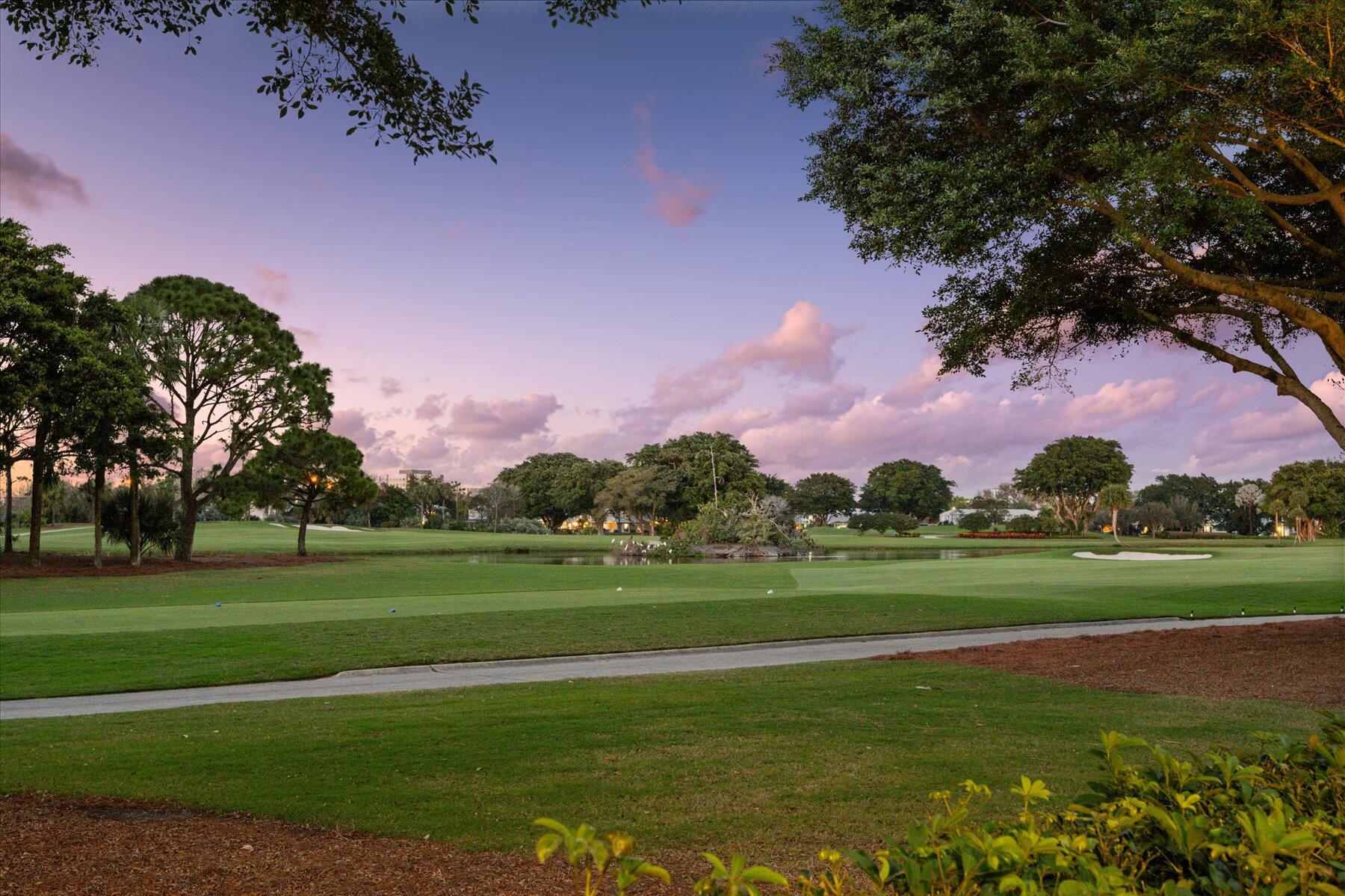 Nestled within Ballenisles Country Club exists the prestigious gated enclave of 12 homes called Grand Key Estates  Within this exclusive location lies this 7000 sq ft majestic home situated on an oversized .63 manicured lot with a mesmerizing view of the 2nd tee of the Championship East Course. Home offers 5 bedrooms plus a large office & media room &  7 bathrooms. Saturnia marble floors flow throughout all main living areas while the office and master bedroom sport harwdood floors. This special home was built with entertainment in mind both outside and inside as evidenced by the spaciousness & designer details  noticeable throughout. Chefs will delight in the Thermador 6 burner cooktop, the Thermador double ovens, Sub zero refrigerator and freezer, two dishwashers, & Butler's Pantry The impressive cherry wood kitchen provides plentiful cabinets to house all of your kitchen wares, an elongated snack bar, breakfast nook, and work space. The kitchen flows seamlessly into  the family room perfect for staying connected to your guests while preparing a gourmet meal. The fabulous main bedroom is enchanting with a sitting area encased in windows, an exercise studio, hardwood floors, 3 custom closets, and an enormous ensuite bathroom with 3 vanity areas with linen towers, his and hers water closets including a bidet, walk in shower, and jacuzzi tub. Be sure to look up and capture the stunning cupula in the bathroom. Step through the bedroom french doors onto the expansive pavered 2 tiered lanai with the spectacular heated pool/spa. Whether you're watching golf while relaxing in the pool or while enjoying a meal in your screened room with built in summer kitchen (DCS grill), this outdoor oasis offers Florida living at its finest. Lastly, in the rear of the screened room lies the cabana house- a wonderful ensuite retreat for your guests. BallenIsles offers its members first class amenities including 3 Championship golf courses, a top rated pilates studio, pickle ball, a world-renown tennis facilities with 20 Har-Tru Clay Courts, state of the art fitness center, bocci courts, a spa and salon, pools and 6 dining options.  Driving through the community is a Disneyesque experience with manicured landscaping and carefully architected flowers. Palm Beach International Airport, fine dining, shopping and beaches are just minutes away. Don't miss your opportunity to own a piece of Ballenisles elite lifestyle.