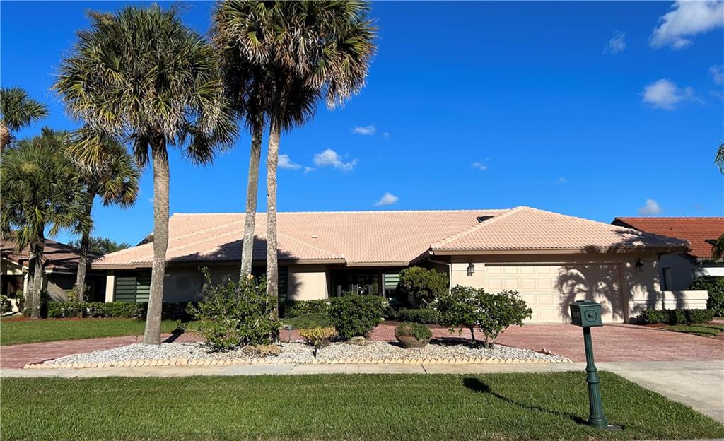 Located in Boca Woods County Club. Beautiful home  features new impact windows, circular driveway with a two car plus golf cart garage, three bedrooms, two and one half baths, an open spacious bright living room and dining room, eat in kitchen with plenty of cabinets, island and a family room. Additional features include an oversized patio pool area with a magnificent lake and golf course view. Resort style living with two 18 hole golf courses, tennis facility, pickelball, new state of the art fitness center, spa, game room, fine/casual dining & more! Mandatory membership $75,000 ($20,000 equity refundable when you sell home) paid to BWCC 10 days prior to closing and additional yearly dues and fees to Boca Woods POA  and Boca Woods CC