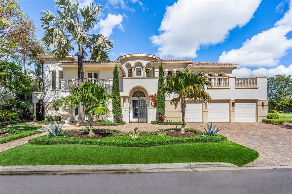 Gorgeous waterfront estate home located on the east end of Coconut Palm Road in Royal Palm Yacht & Country Club, This residence has been recently updated with stunning transitional interior and classic finishes. Notable features include a spectacular two-story rotunda, elegant formal living room, large formal dining room, beautiful open concept kitchen with butler's pantry,  family room, office, and a highly desirable first floor master suite with water views, soaring ceilings and large spa bath. This home also has a concrete second floor, lutron lighting system, 3.5 car garage, oversized pool with spa and waterfall, and sits on 102 feet of deep water with no fixed bridges. An incredible opportunity to live on the water in one of Boca Raton's most sought after communities.