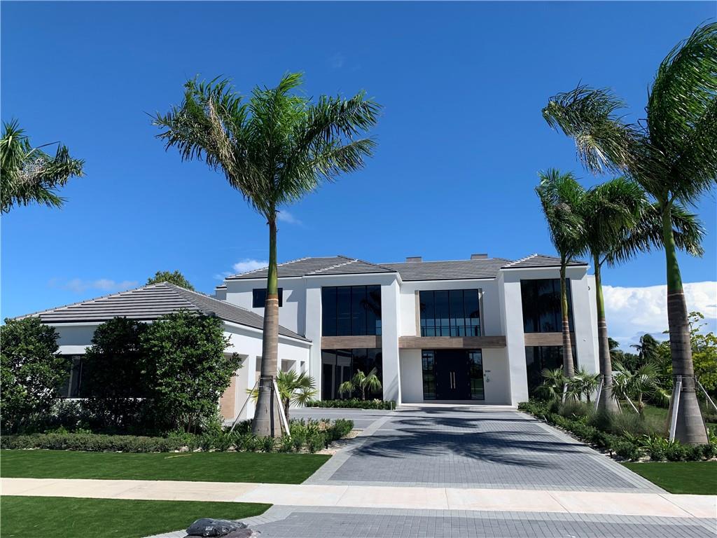 Golf course living at it’s finest in this 5 BR | 6.5 Bath | 3.5 Car | 2 Laundry | Office | two story modern custom residence located in the guard gated golf course community of The Enclave at the Coral Ridge Country Club. Two stories of floor to ceiling windows greet you as you enter the foyer, living and dining rooms showcasing the renowned Robert Trent Jones, Sr. 18- hole championship golf course. Floor to ceiling windows and sliders are found throughout, including the kitchen finished with custom cabinetry, large island, walk-in pantry and Thermador/ Sub-Zero appliances. Access the 2nd flood by the elevator or floating staircase with glass and metal railing. Large master bedroom with sitting area and stunning master bathroom, all with east and southeast gold course views.